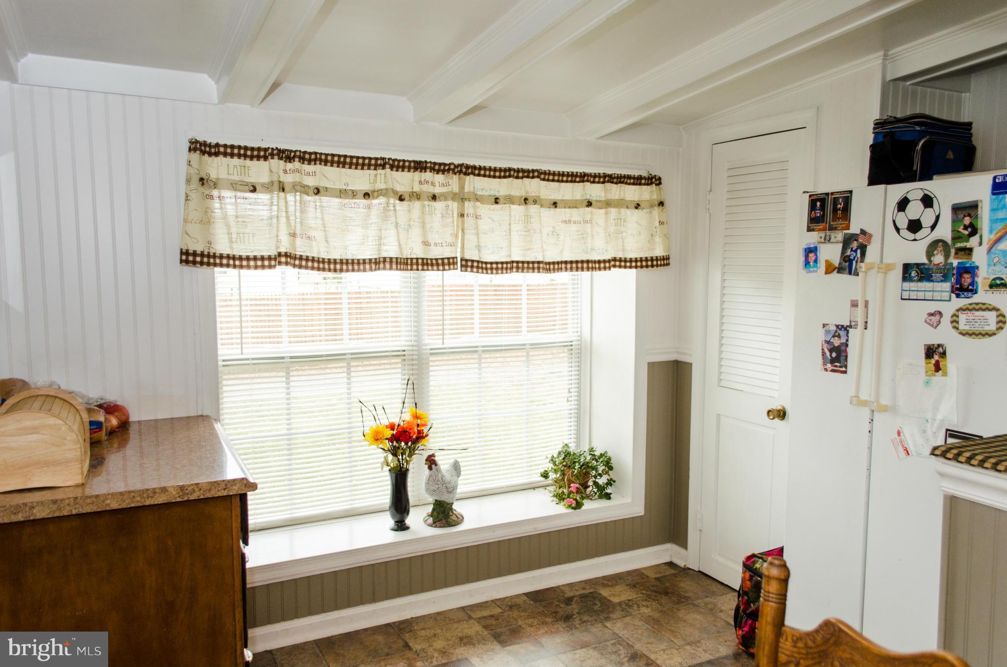 305 Algers Avenue Ranson, WV 25438 - Photo 7 of 30 a view of a living room and a window with wooden floor