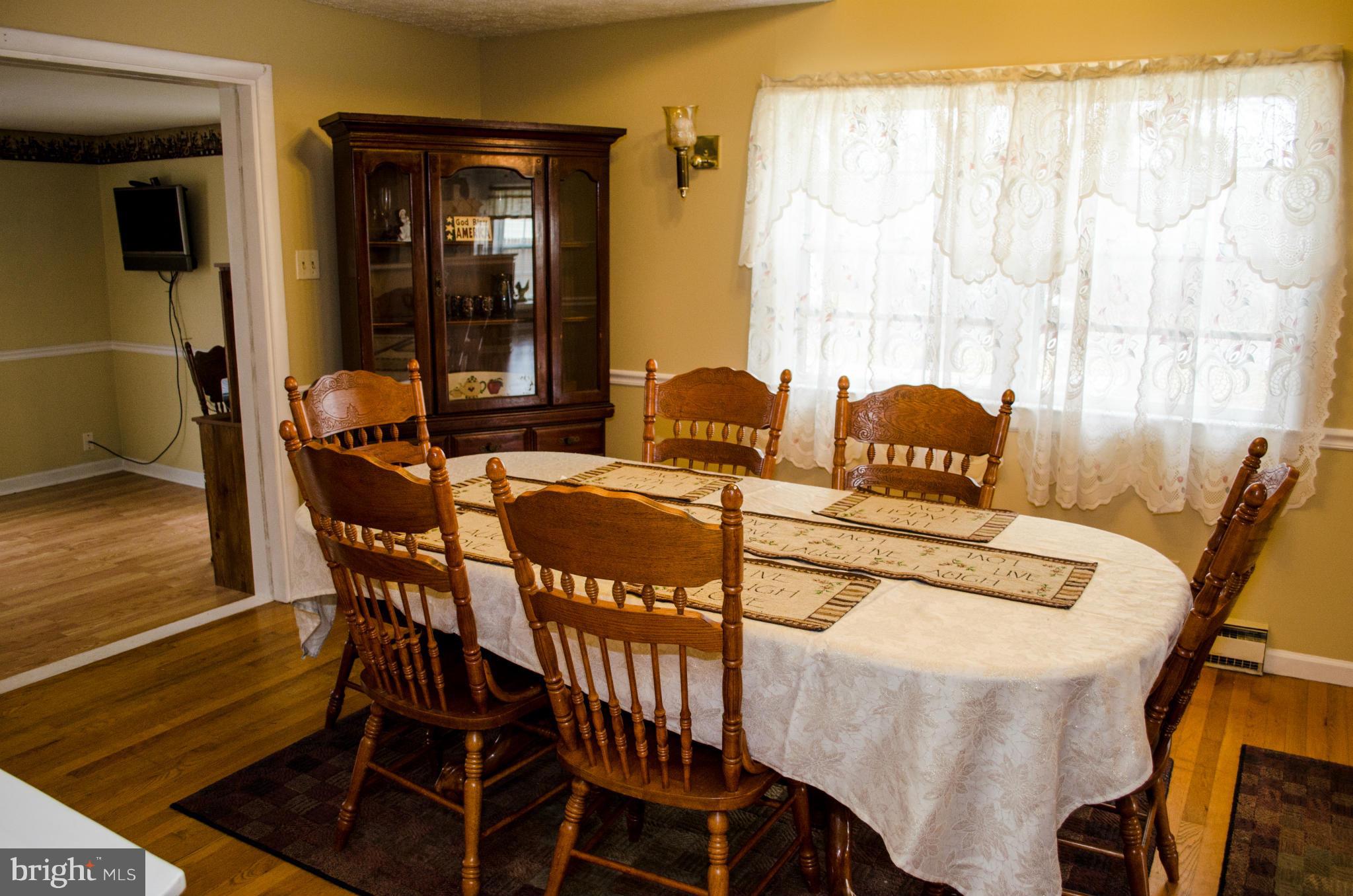 305 Algers Avenue Ranson, WV 25438 - Photo 10 of 30 a view of a dining room with furniture and wooden floor