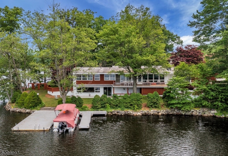 17 Emerson Road Hewitt, NJ 07421 - Photo 1 of 25 a swimming pool with outdoor seating and yard