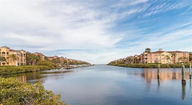 a view of a balcony with wooden floor and iron stairs