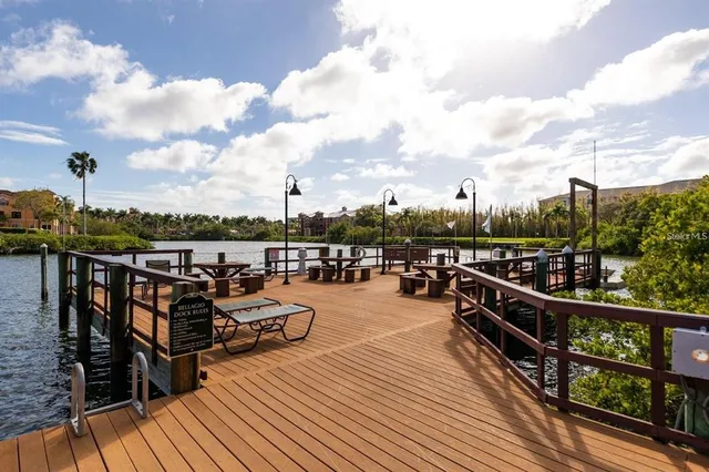 a view of a lake with houses in the back