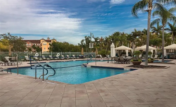 a view of a swimming pool and lounge chair