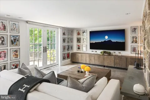 a kitchen with stainless steel appliances granite countertop a stove a sink dishwasher and cabinets with wooden floor