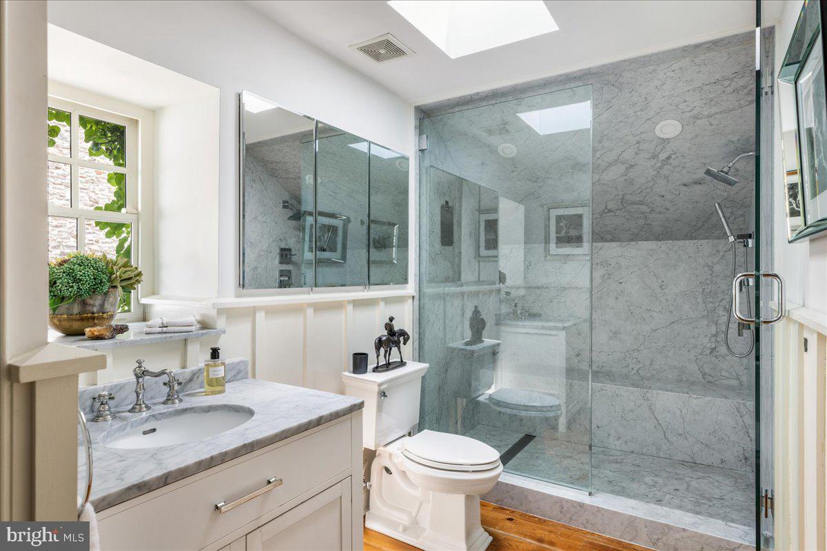 5966 Mechanicsville Road Doylestown, PA 18902 - Photo 40 of 89 a bathroom with a granite countertop sink toilet mirror and shower