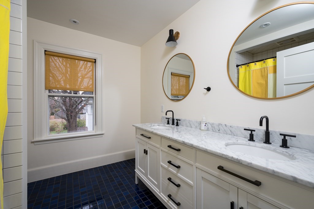 460 Main Street Hingham, MA 02043 - Photo 23 of 42 a bathroom with a granite countertop double vanity sink and a mirror
