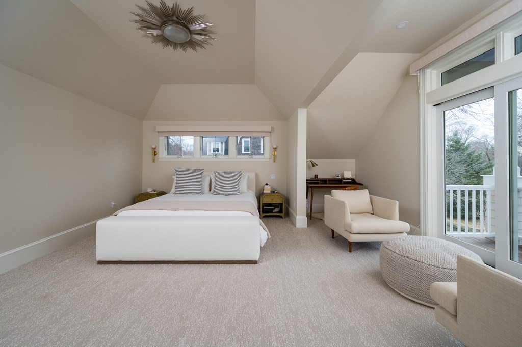 460 Main Street Hingham, MA 02043 - Photo 30 of 42 a spacious bedroom with a bed and a large window