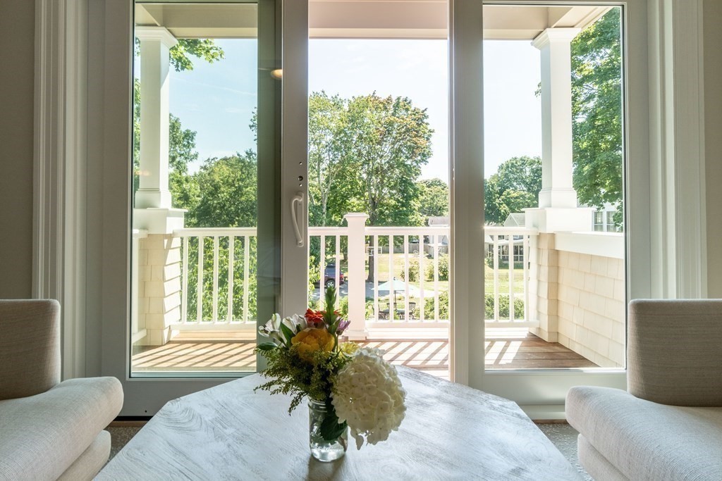 460 Main Street Hingham, MA 02043 - Photo 31 of 42 a living room with furniture and a large window