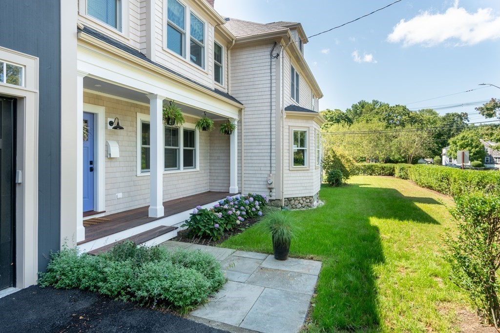 460 Main Street Hingham, MA 02043 - Photo 40 of 42 a front view of a house with garden