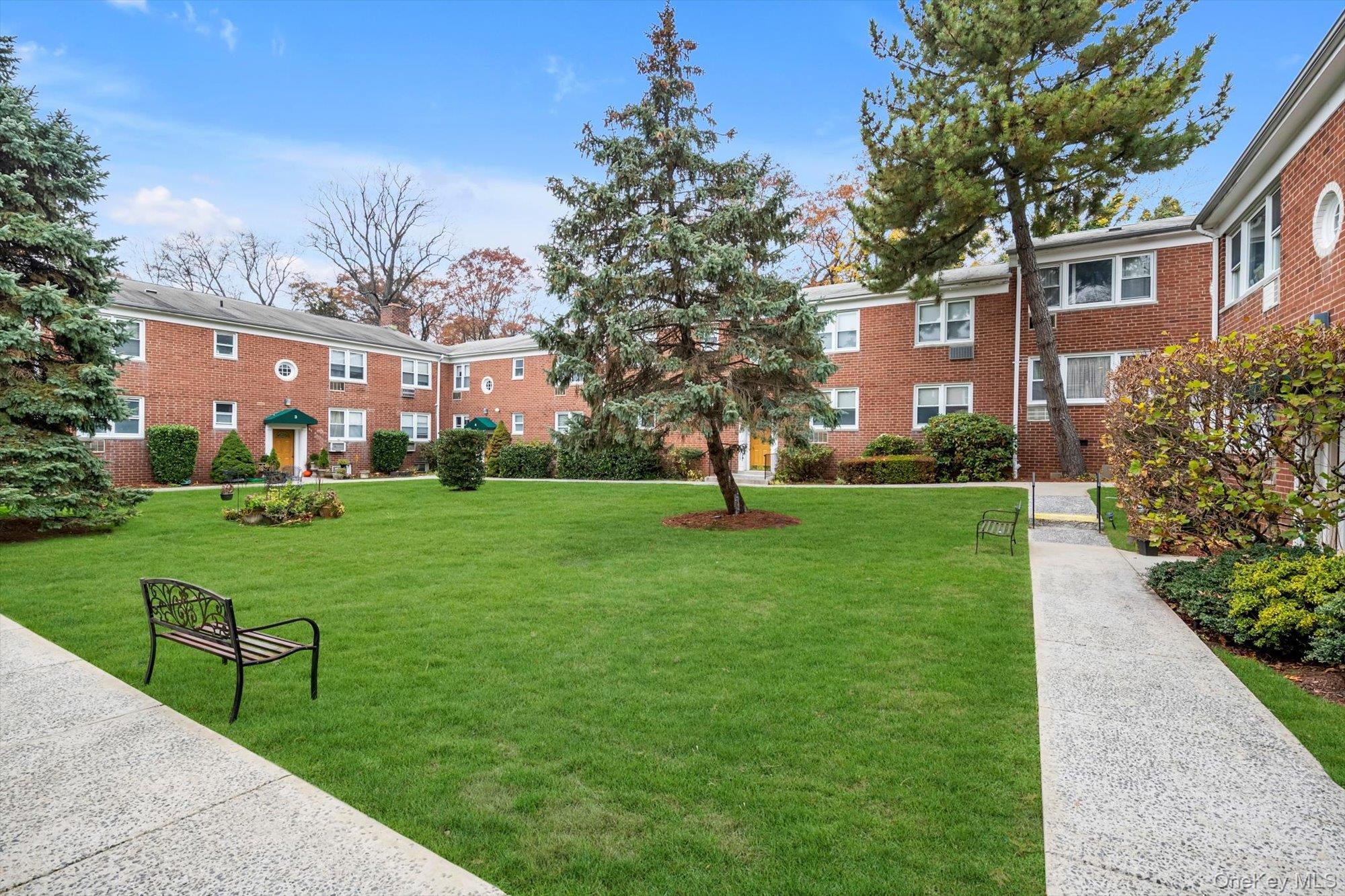 643 Pelham Road, Unit 6D New Rochelle, NY 10805 - Photo 12 of 12 a view of house with a garden