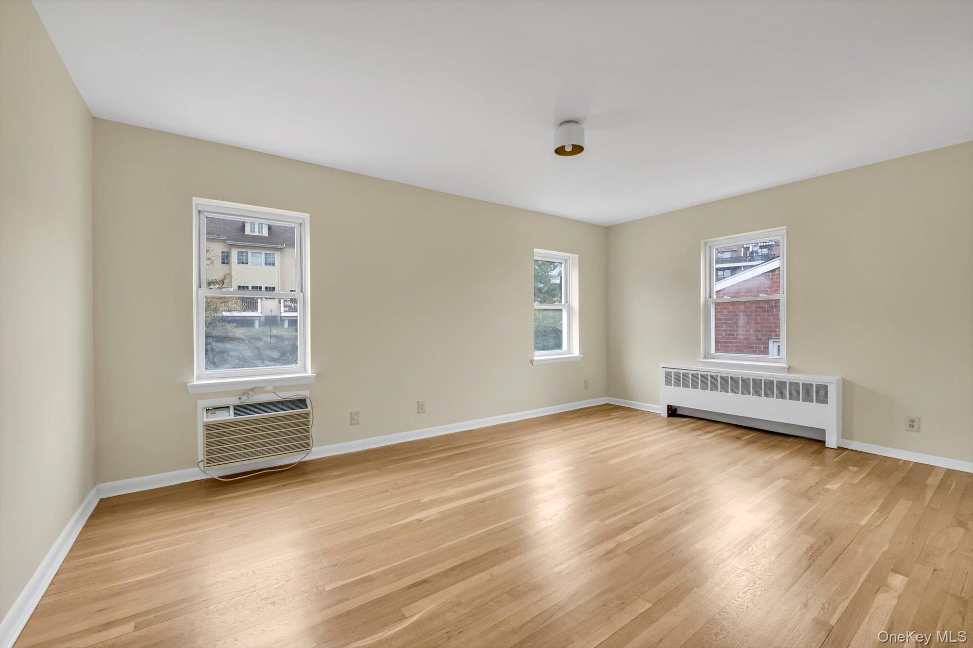 643 Pelham Road, Unit 6D New Rochelle, NY 10805 - Photo 9 of 12 a view of a room with wooden floor and window
