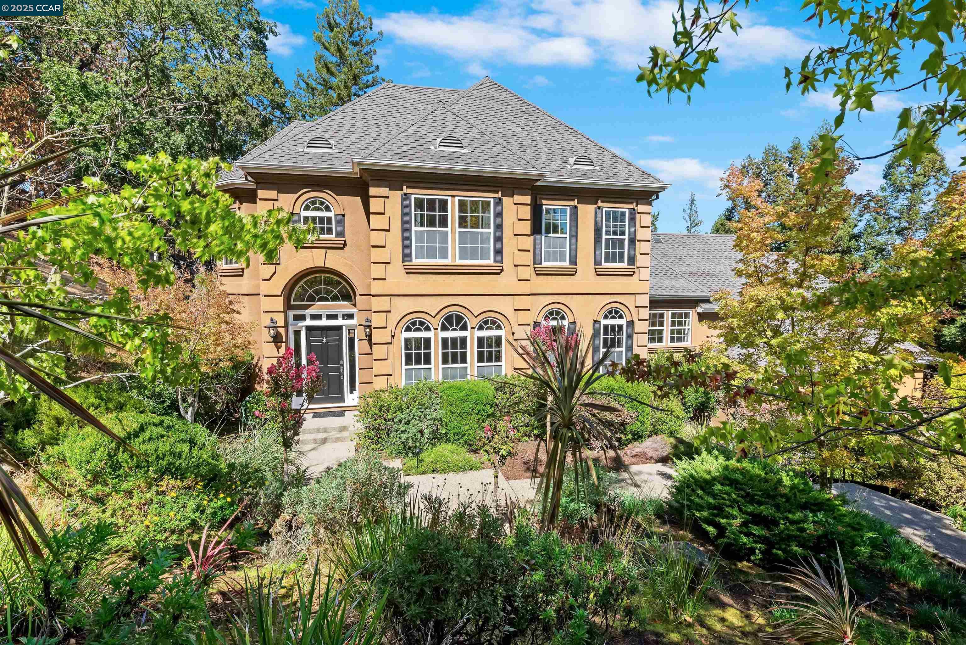 a front view of a house with a yard