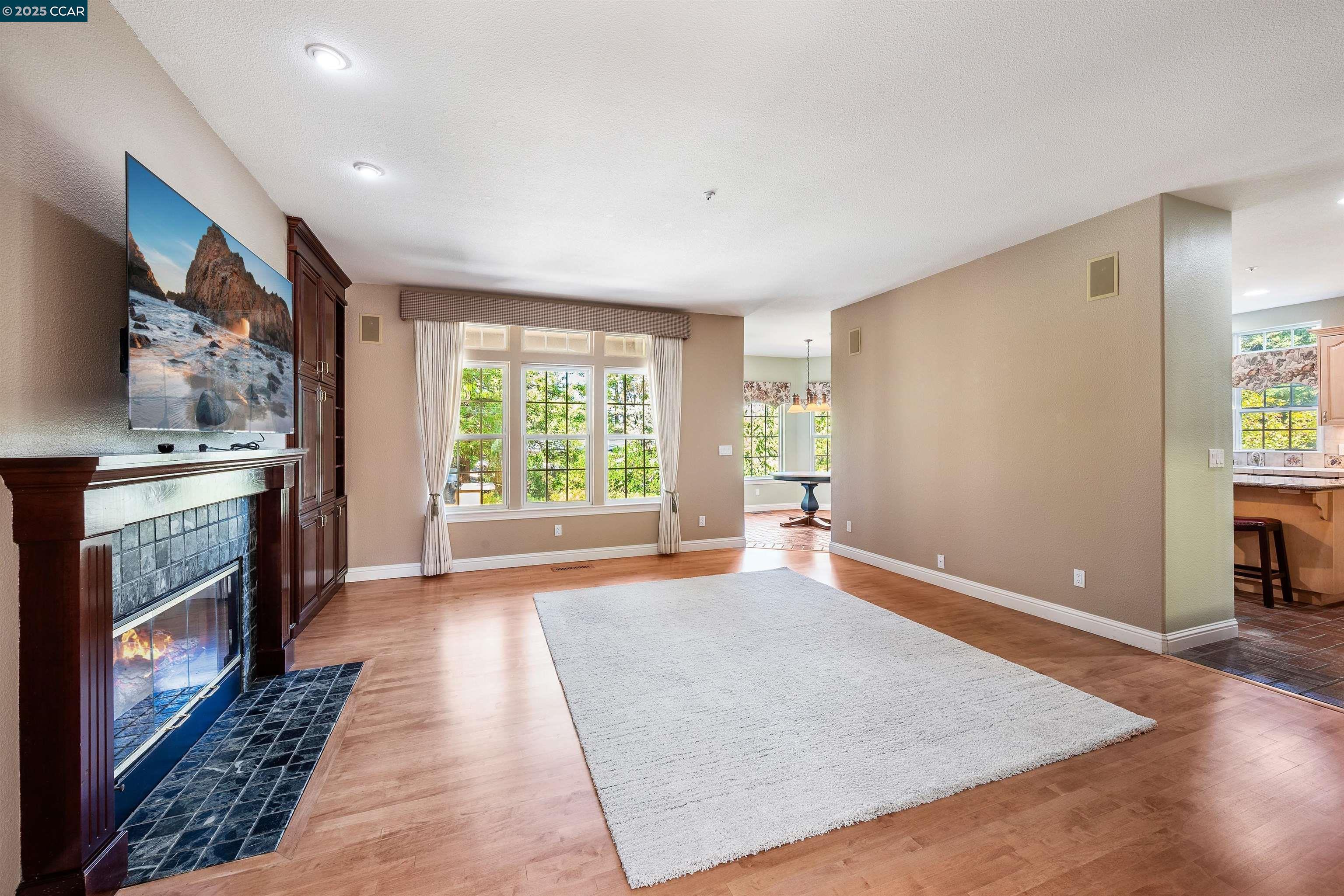 20 Oak Crest Lane Alamo, CA 94507 - Photo 15 of 41 a view of a kitchen with furniture and a fireplace