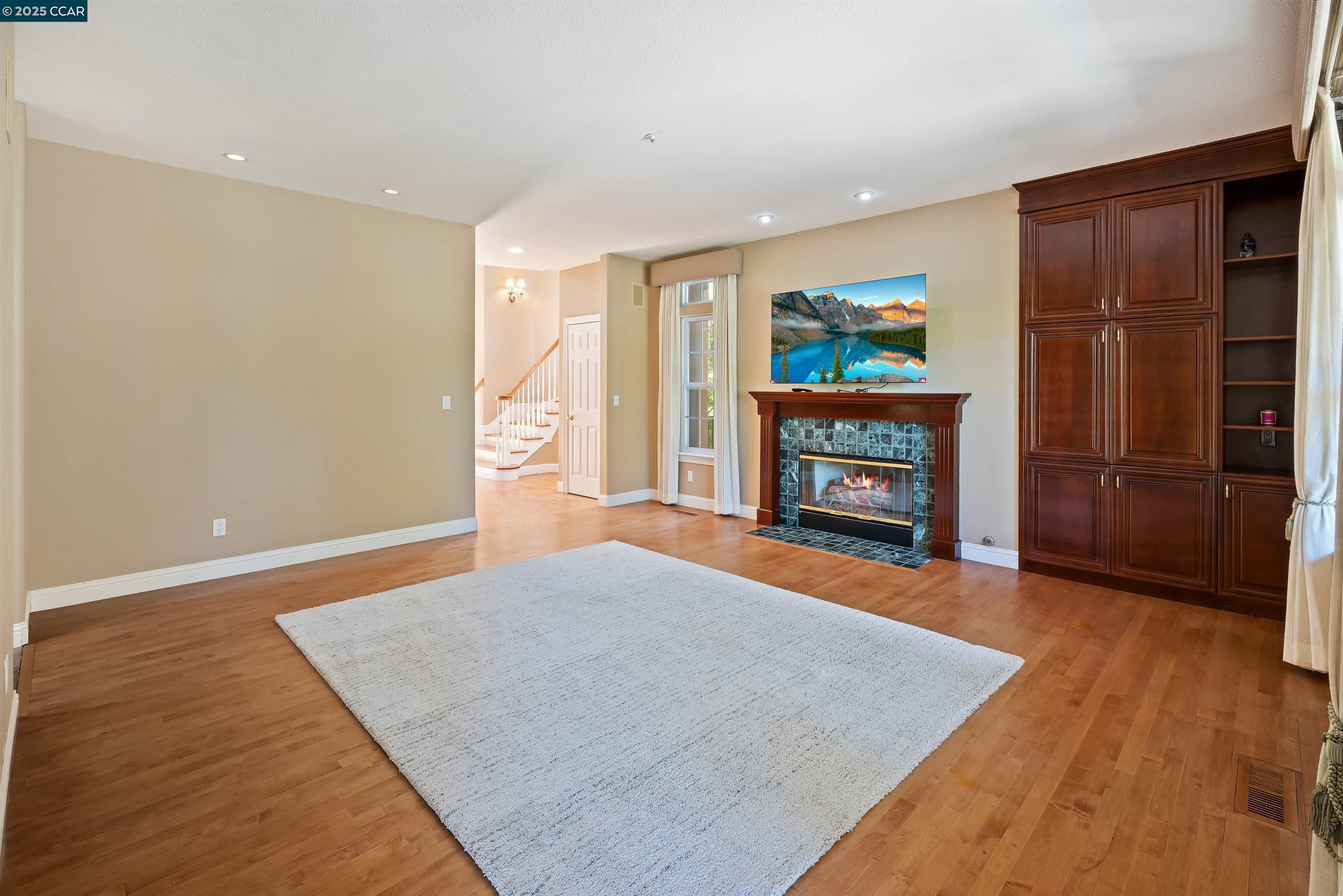 20 Oak Crest Lane Alamo, CA 94507 - Photo 16 of 41 a living room with furniture and a fireplace