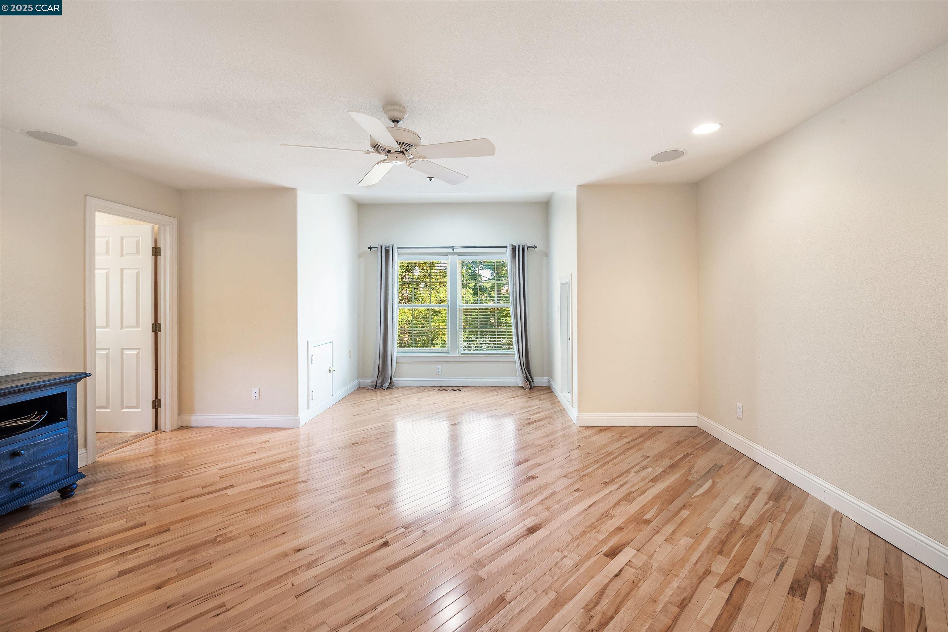 20 Oak Crest Lane Alamo, CA 94507 - Photo 18 of 41 a view of an empty room with wooden floor and a window