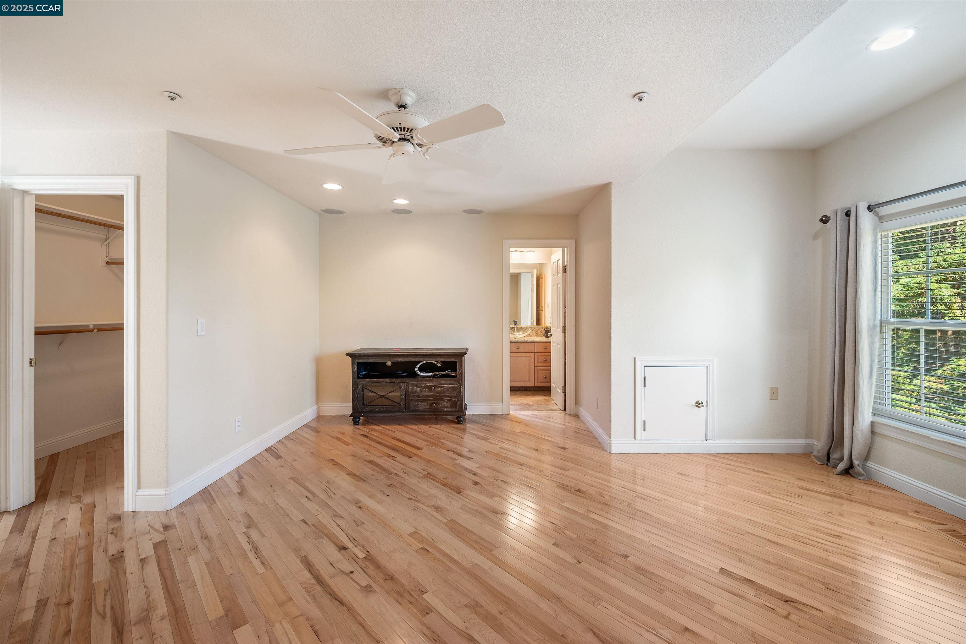 20 Oak Crest Lane Alamo, CA 94507 - Photo 19 of 41 wooden floor in an empty room with a window