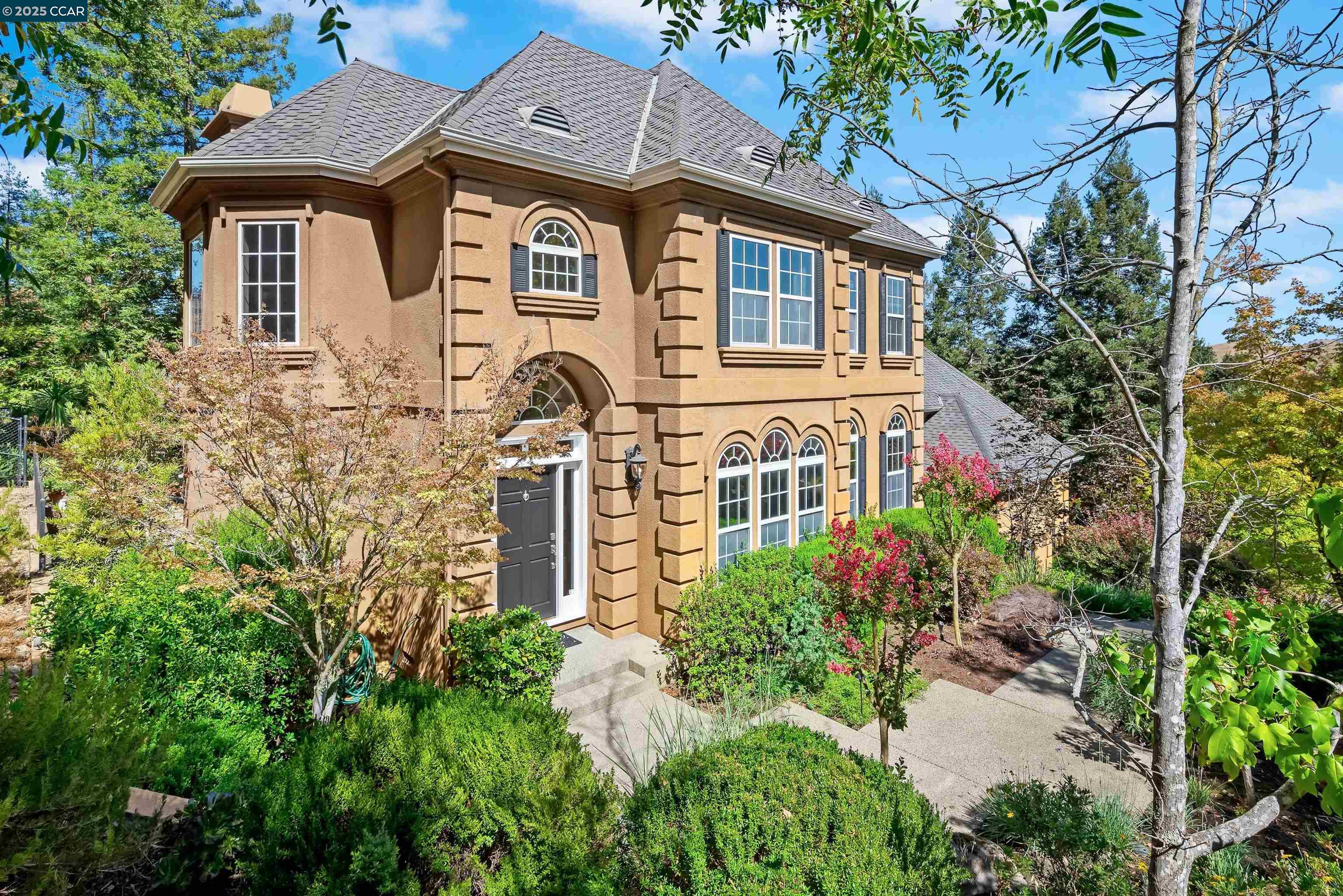 20 Oak Crest Lane Alamo, CA 94507 - Photo 2 of 41 a front view of a house with a garden