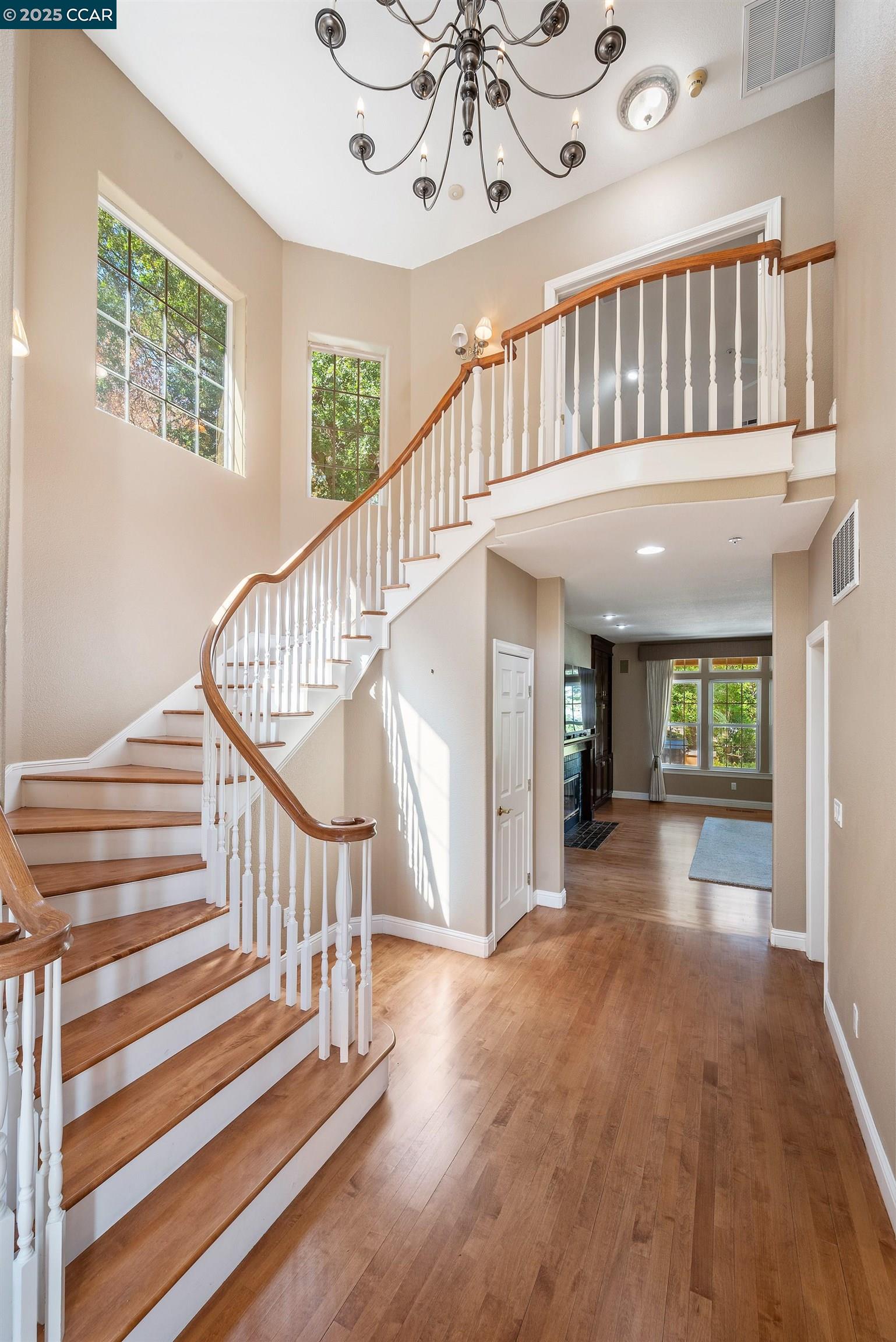 20 Oak Crest Lane Alamo, CA 94507 - Photo 21 of 41 a view of staircase with lots of frames and couches