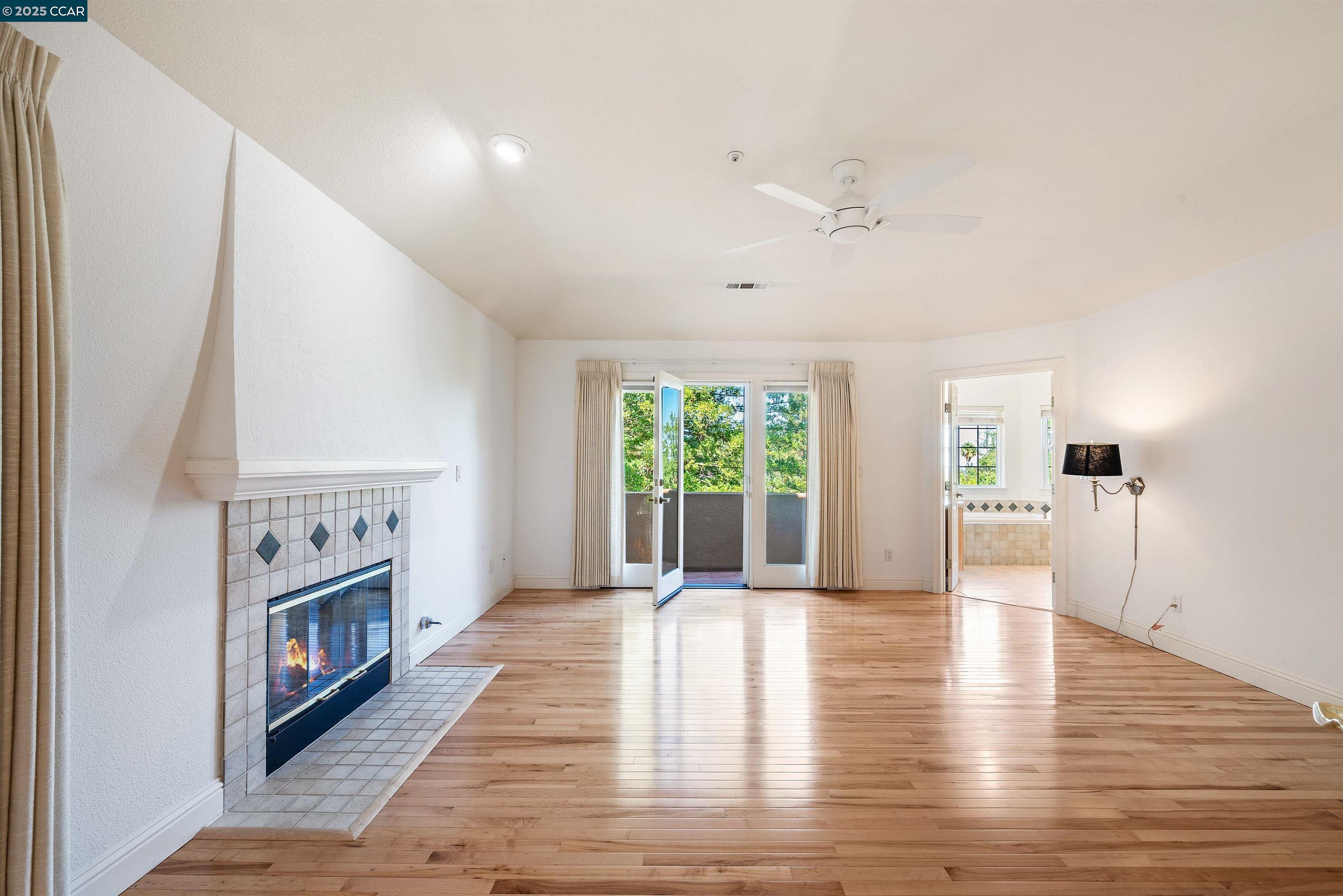 20 Oak Crest Lane Alamo, CA 94507 - Photo 23 of 41 a view of an empty room with a fireplace and a window