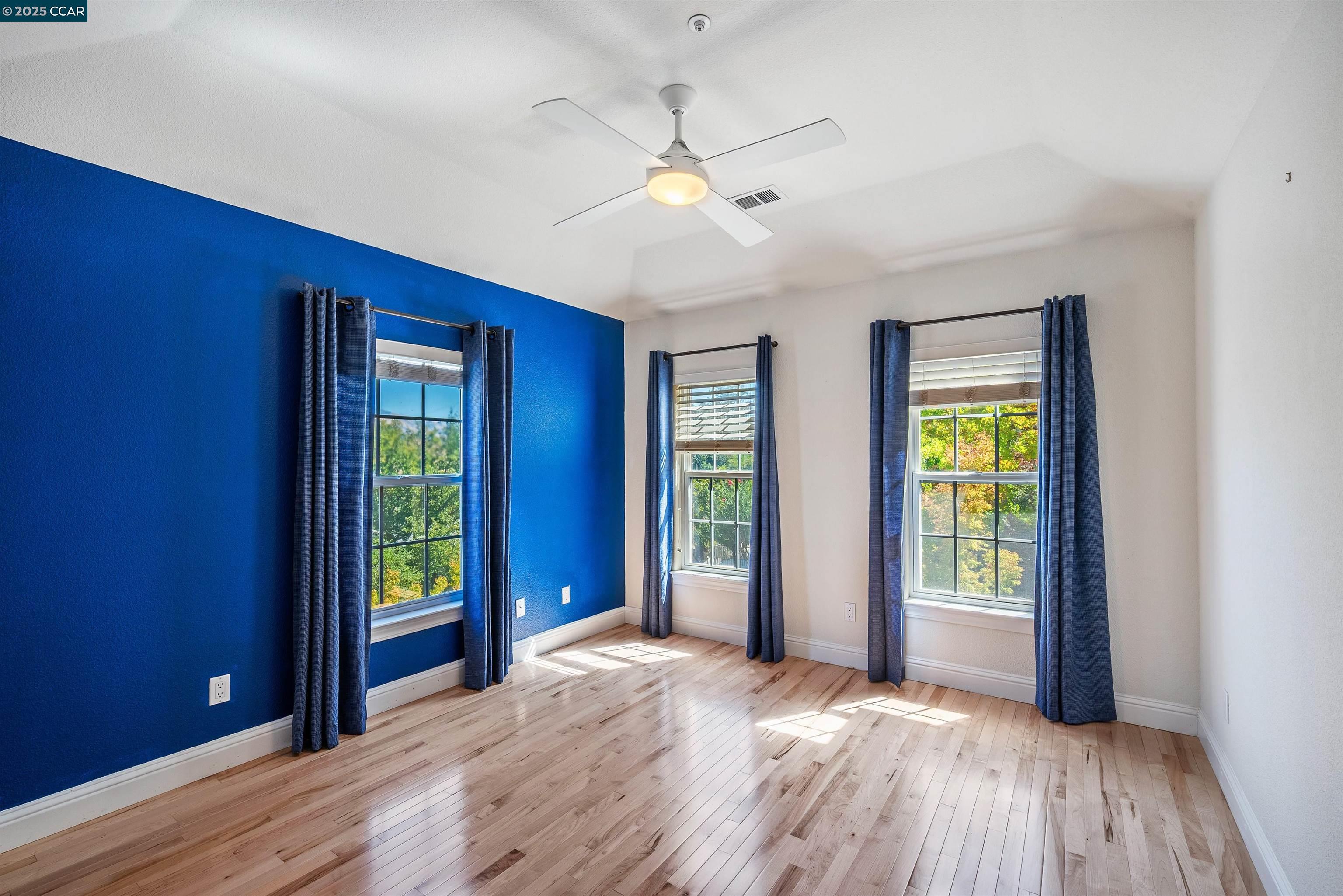 20 Oak Crest Lane Alamo, CA 94507 - Photo 31 of 41 a view of an empty room with window and wooden floor