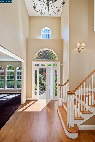 a view of entryway with wooden floor