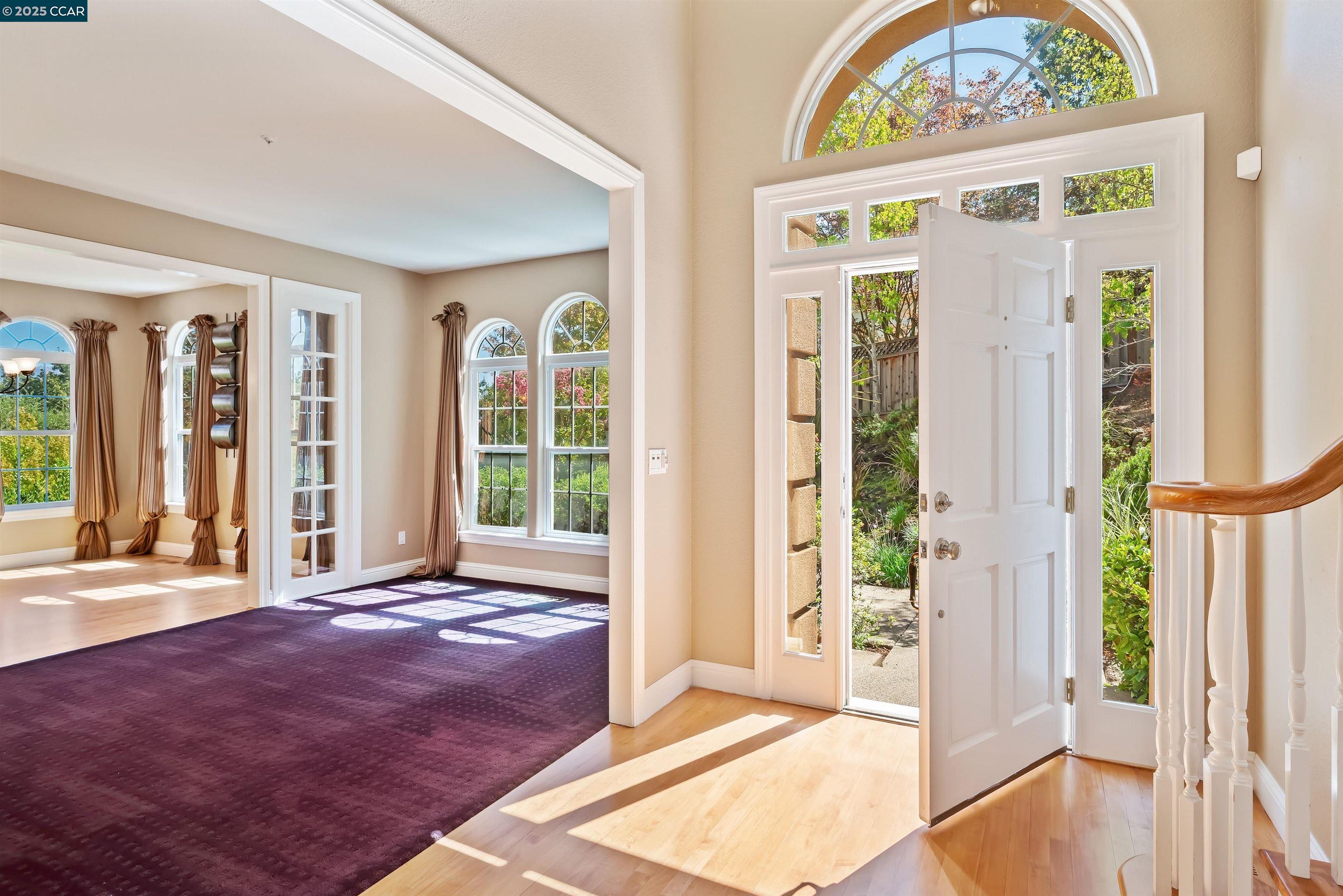 20 Oak Crest Lane Alamo, CA 94507 - Photo 7 of 41 a view of an entryway with a floor to ceiling window and a living room
