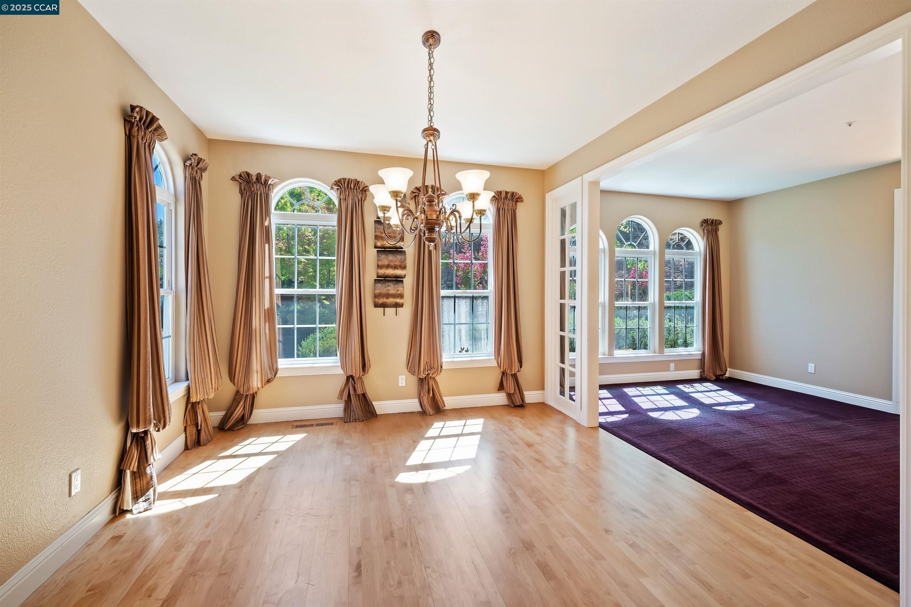 20 Oak Crest Lane Alamo, CA 94507 - Photo 9 of 41 a view of an empty room with wooden floor and a window