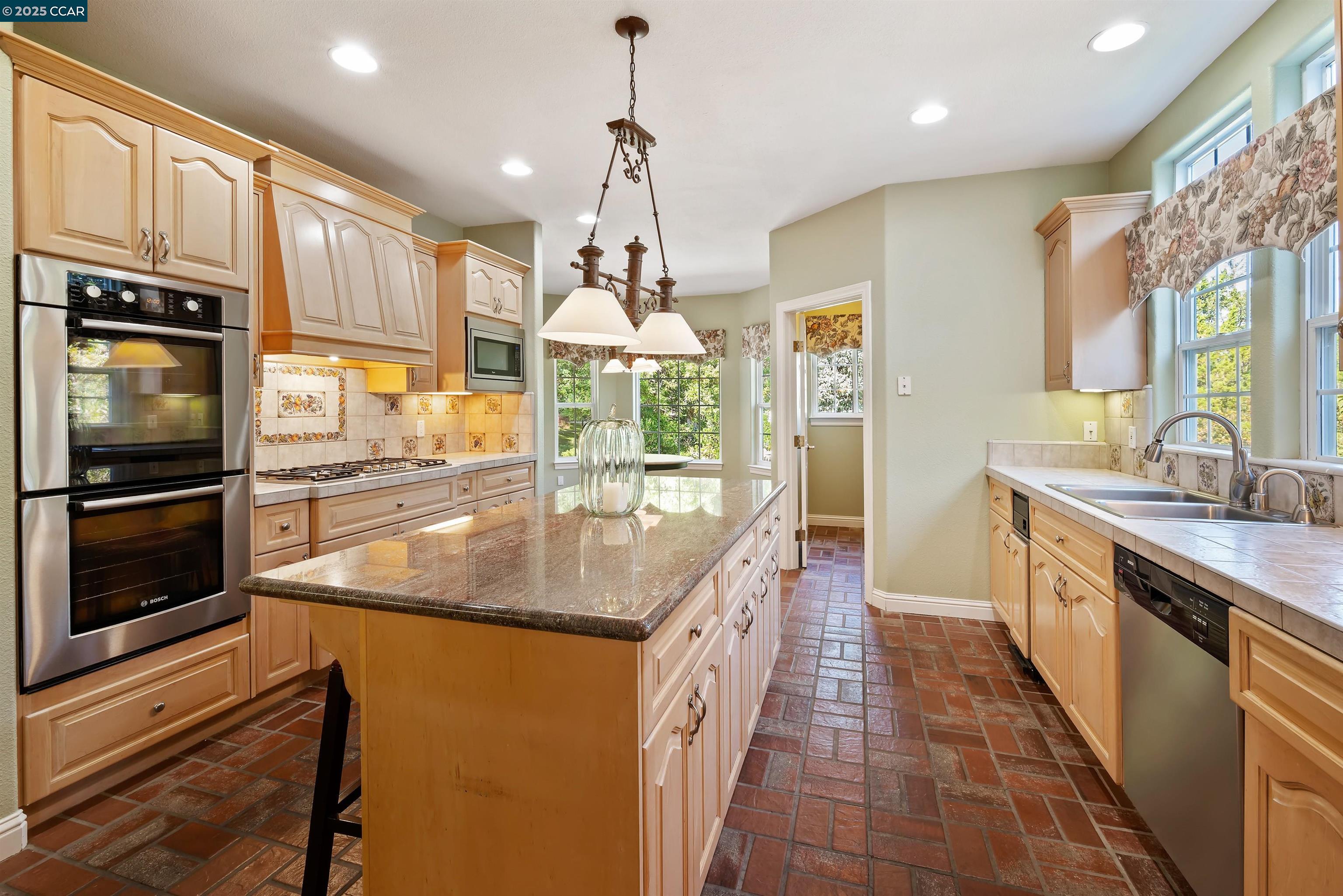 20 Oak Crest Lane Alamo, CA 94507 - Photo 10 of 41 a kitchen with stainless steel appliances granite countertop a sink and oven