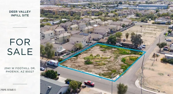 an aerial view of residential building with green space