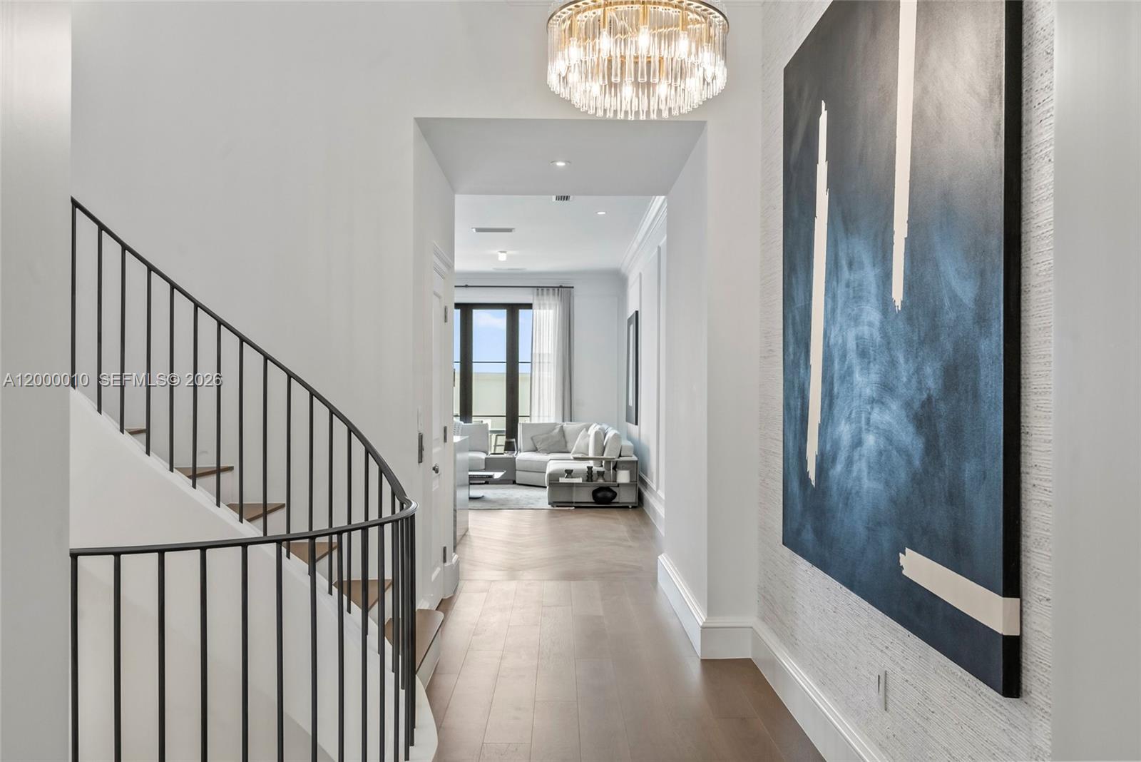 2617 Anderson Road Coral Gables, FL 33134 - Photo 11 of 49 a view of a hallway with couches and chandelier
