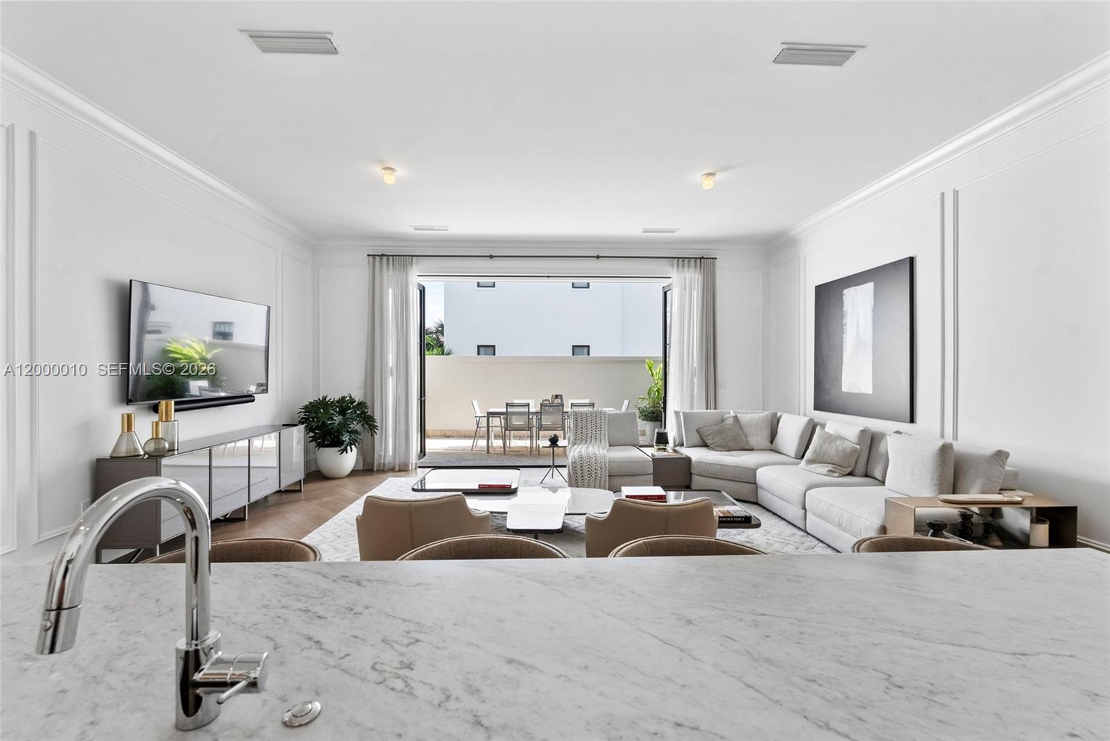 2617 Anderson Road Coral Gables, FL 33134 - Photo 23 of 49 a living room with furniture and a flat screen tv