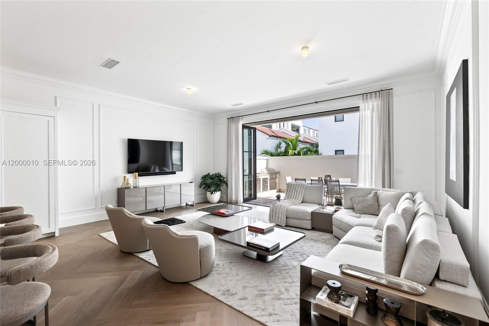 2617 Anderson Road Coral Gables, FL 33134 - Photo 24 of 49 a living room with furniture and a flat screen tv