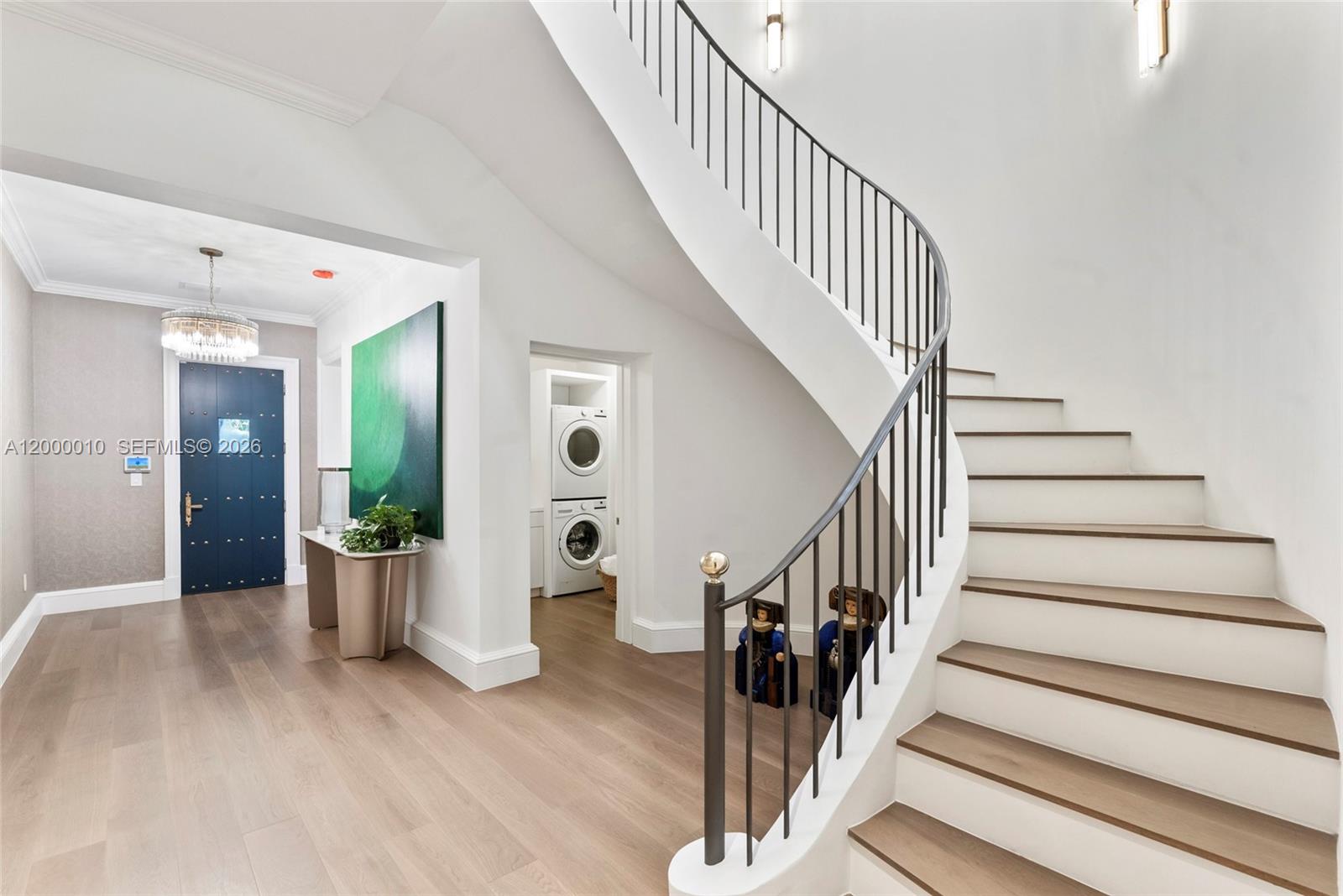 2617 Anderson Road Coral Gables, FL 33134 - Photo 3 of 49 a view of entryway with wooden floor and stairs