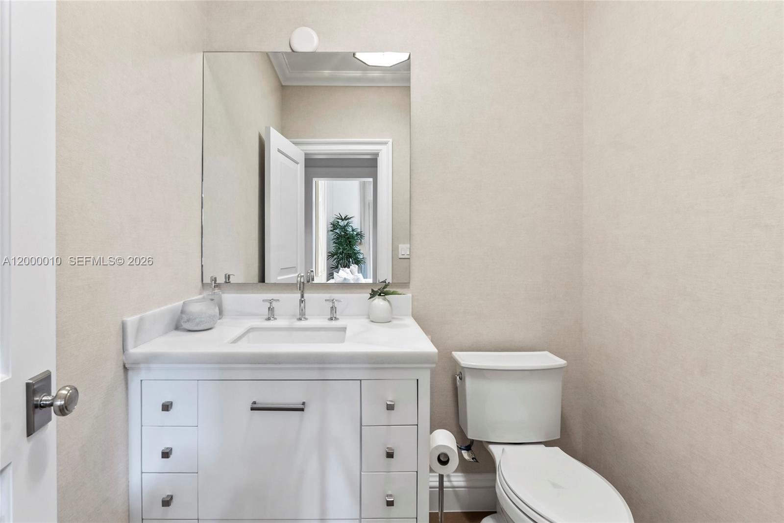 2617 Anderson Road Coral Gables, FL 33134 - Photo 32 of 49 a bathroom with a sink toilet and mirror