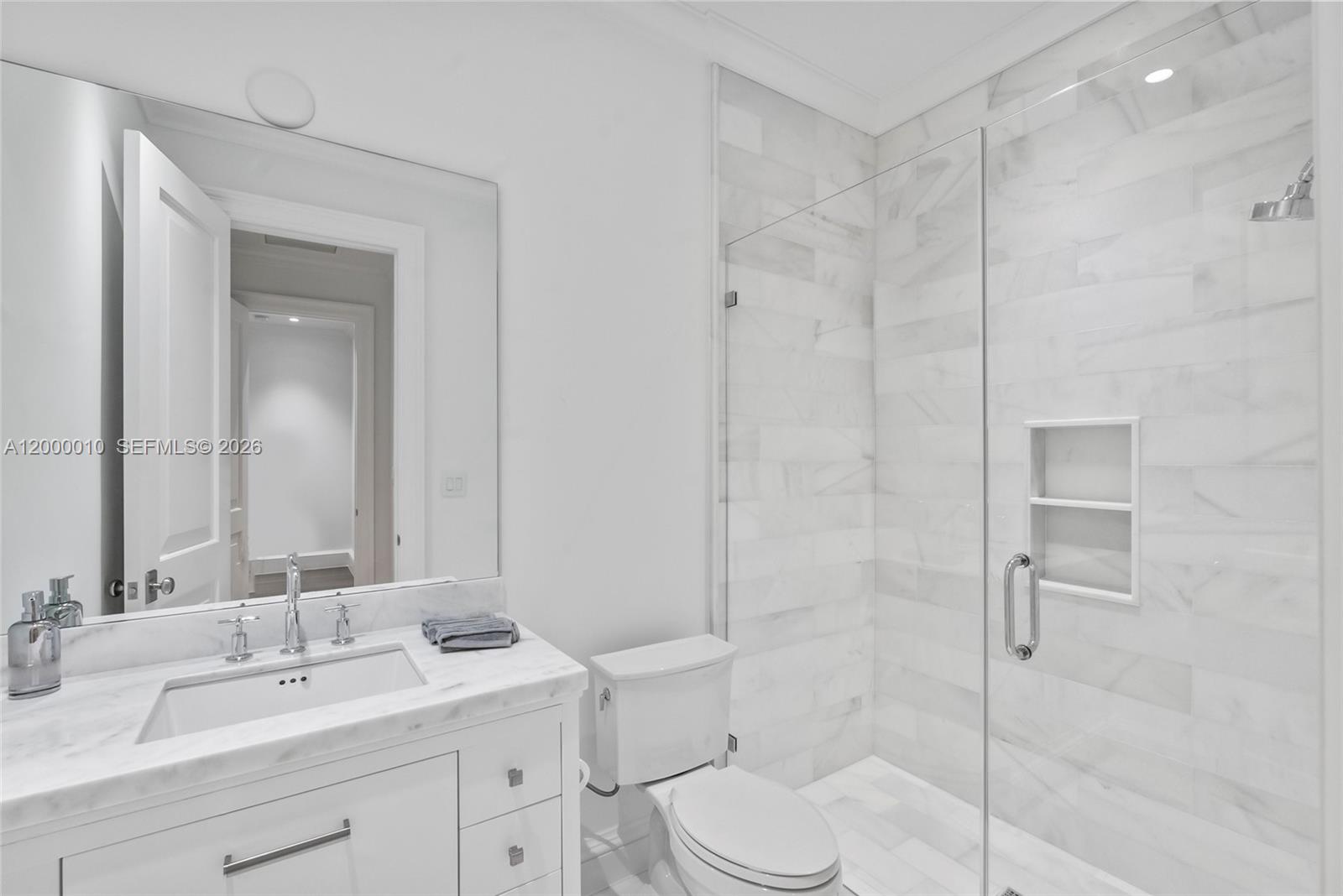 2617 Anderson Road Coral Gables, FL 33134 - Photo 42 of 49 a bathroom with a granite countertop sink a toilet and shower