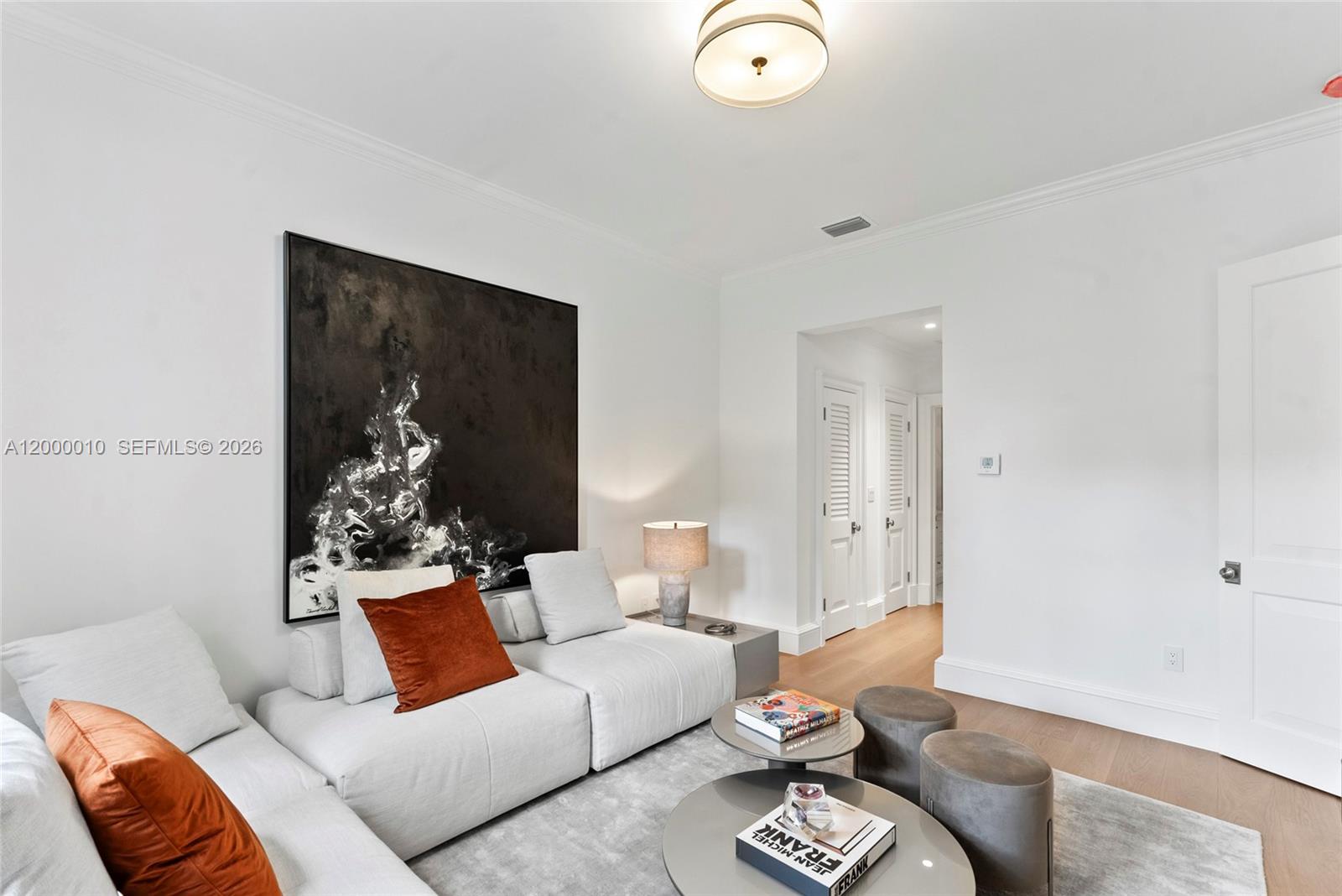 2617 Anderson Road Coral Gables, FL 33134 - Photo 7 of 49 a living room with furniture and a painting on the wall