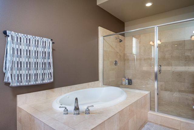 a bathroom with a shower and a sink