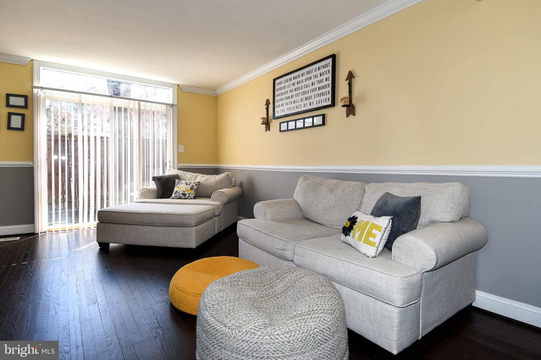 12604 Dulcinea Place Woodbridge, VA 22192 - Photo 14 of 63 a living room with furniture and a wooden floor