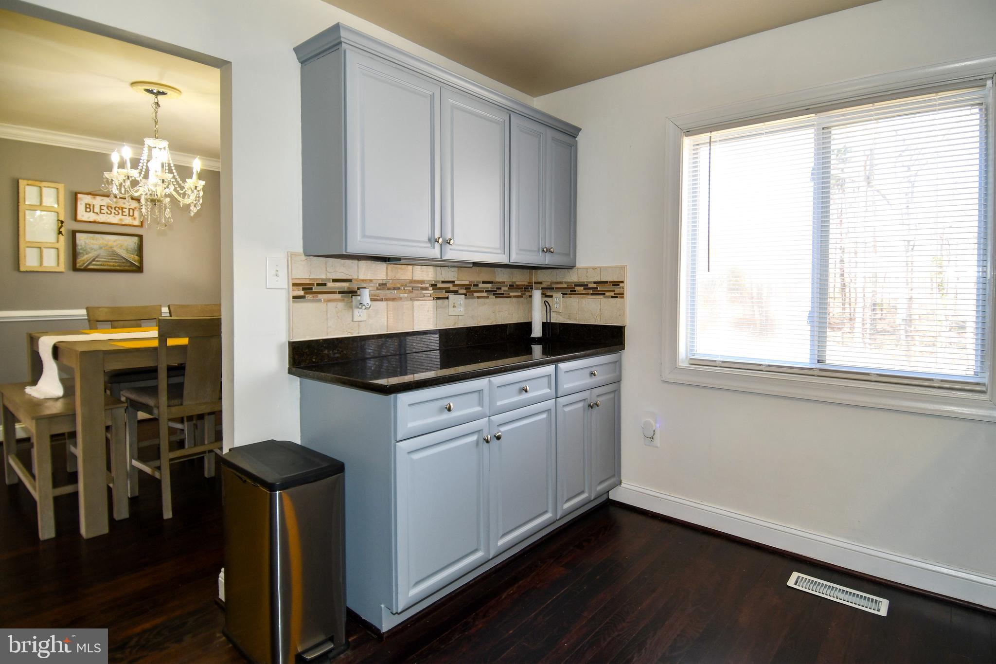 12604 Dulcinea Place Woodbridge, VA 22192 - Photo 24 of 63 a kitchen with stainless steel appliances granite countertop a sink and a stove