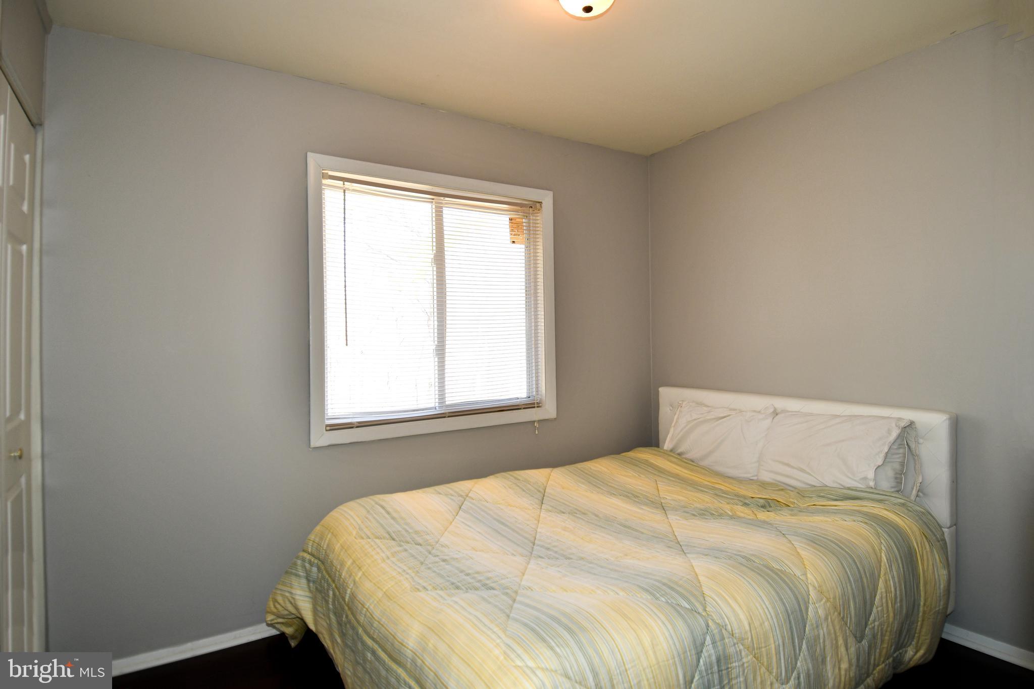 12604 Dulcinea Place Woodbridge, VA 22192 - Photo 29 of 63 a large bed sitting in a bedroom next to a window