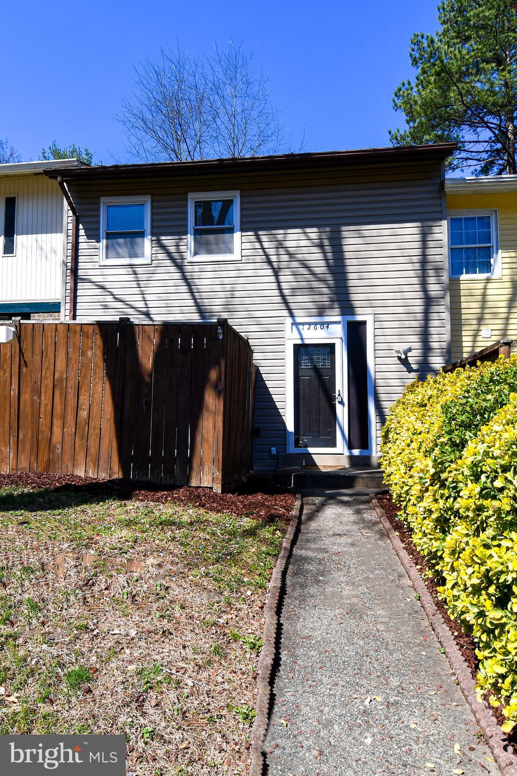 12604 Dulcinea Place Woodbridge, VA 22192 - Photo 3 of 63 a house with trees in the background