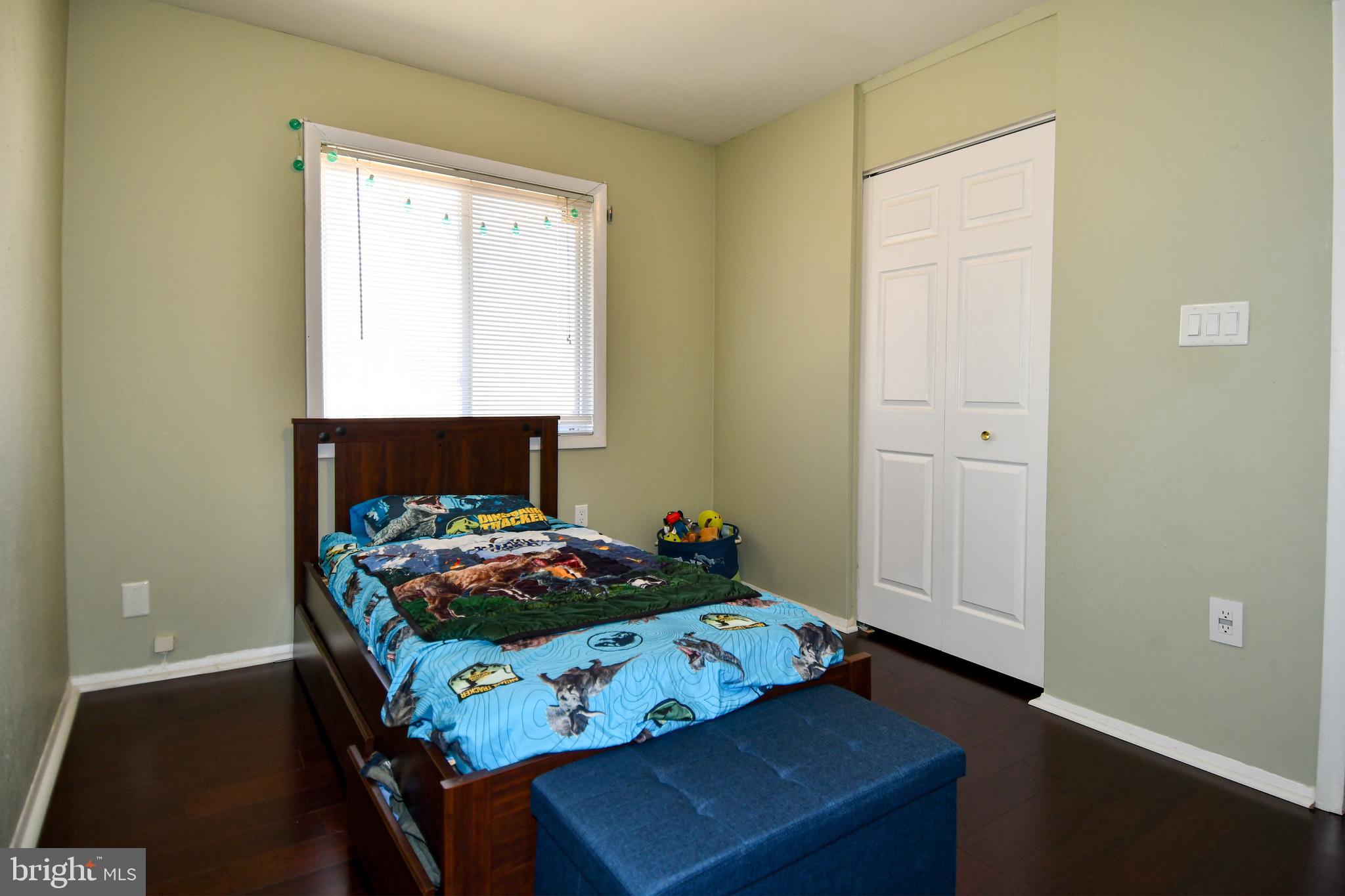 12604 Dulcinea Place Woodbridge, VA 22192 - Photo 31 of 63 a bedroom with a bed and a window