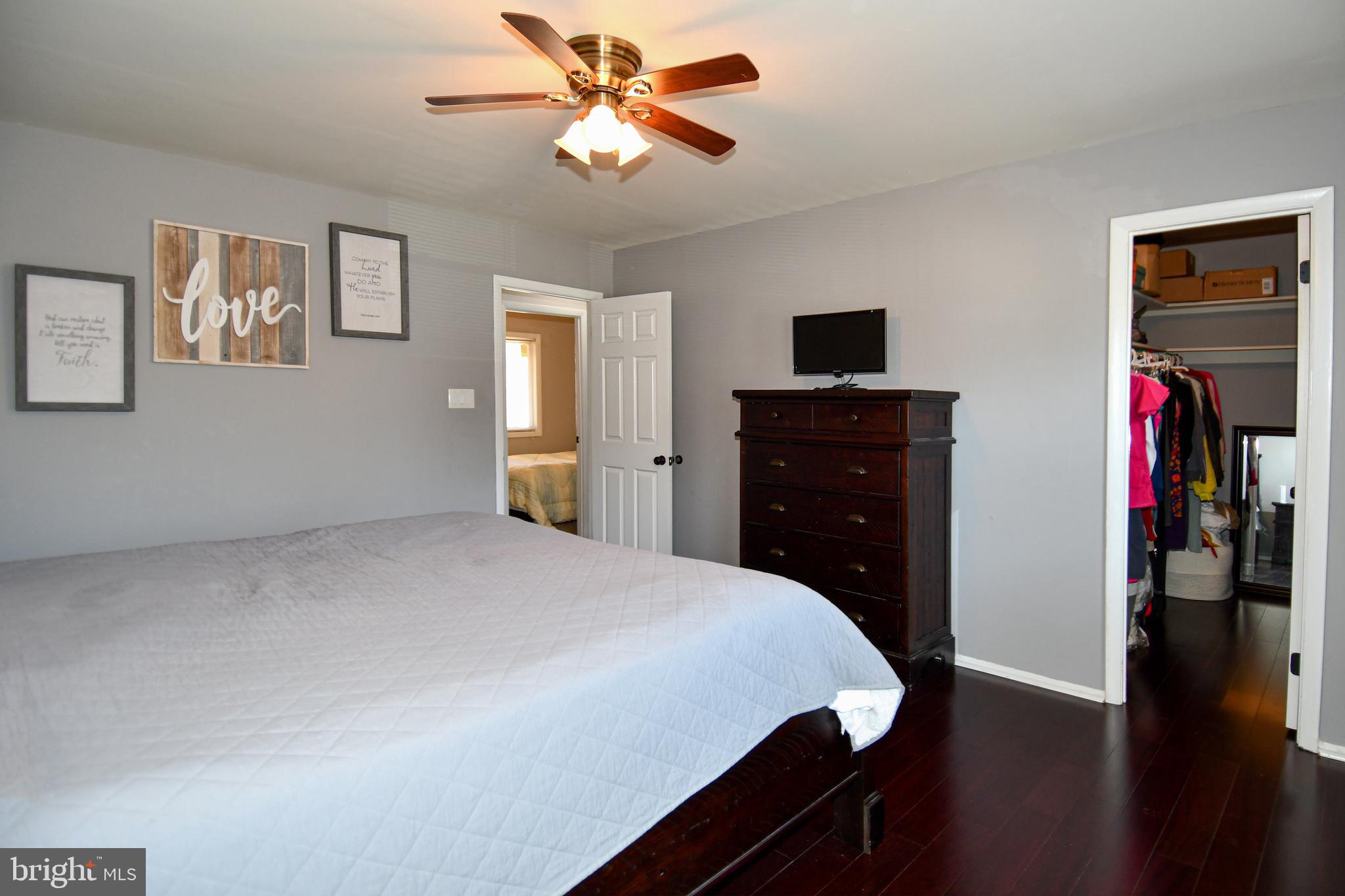 12604 Dulcinea Place Woodbridge, VA 22192 - Photo 37 of 63 a bedroom with a bed and a tv