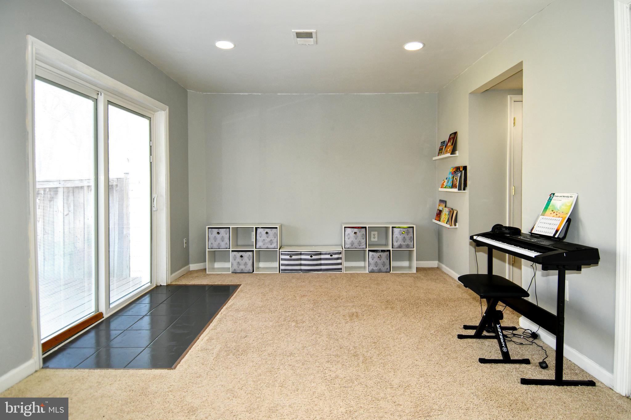 12604 Dulcinea Place Woodbridge, VA 22192 - Photo 39 of 63 a view of a workspace with furniture and a window