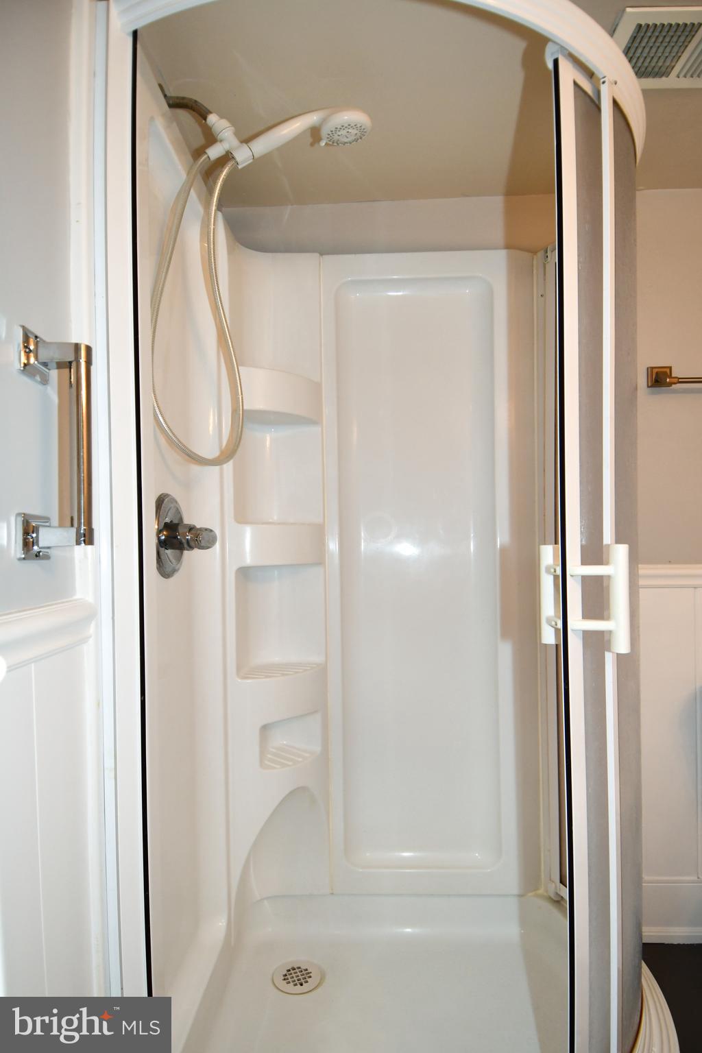 12604 Dulcinea Place Woodbridge, VA 22192 - Photo 44 of 63 a bathroom with a glass shower door