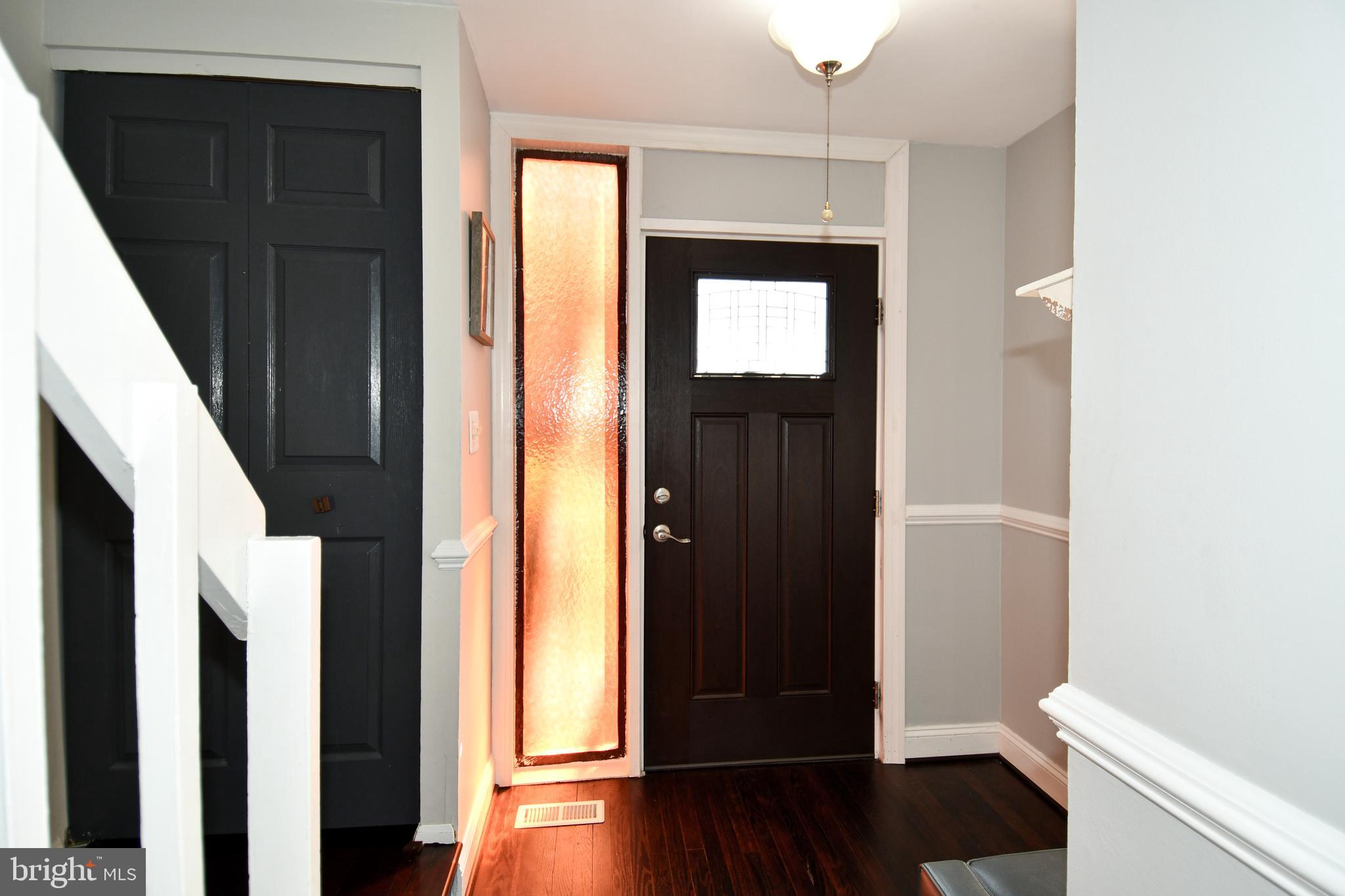 12604 Dulcinea Place Woodbridge, VA 22192 - Photo 5 of 63 a view of a hallway with wooden floor and closet