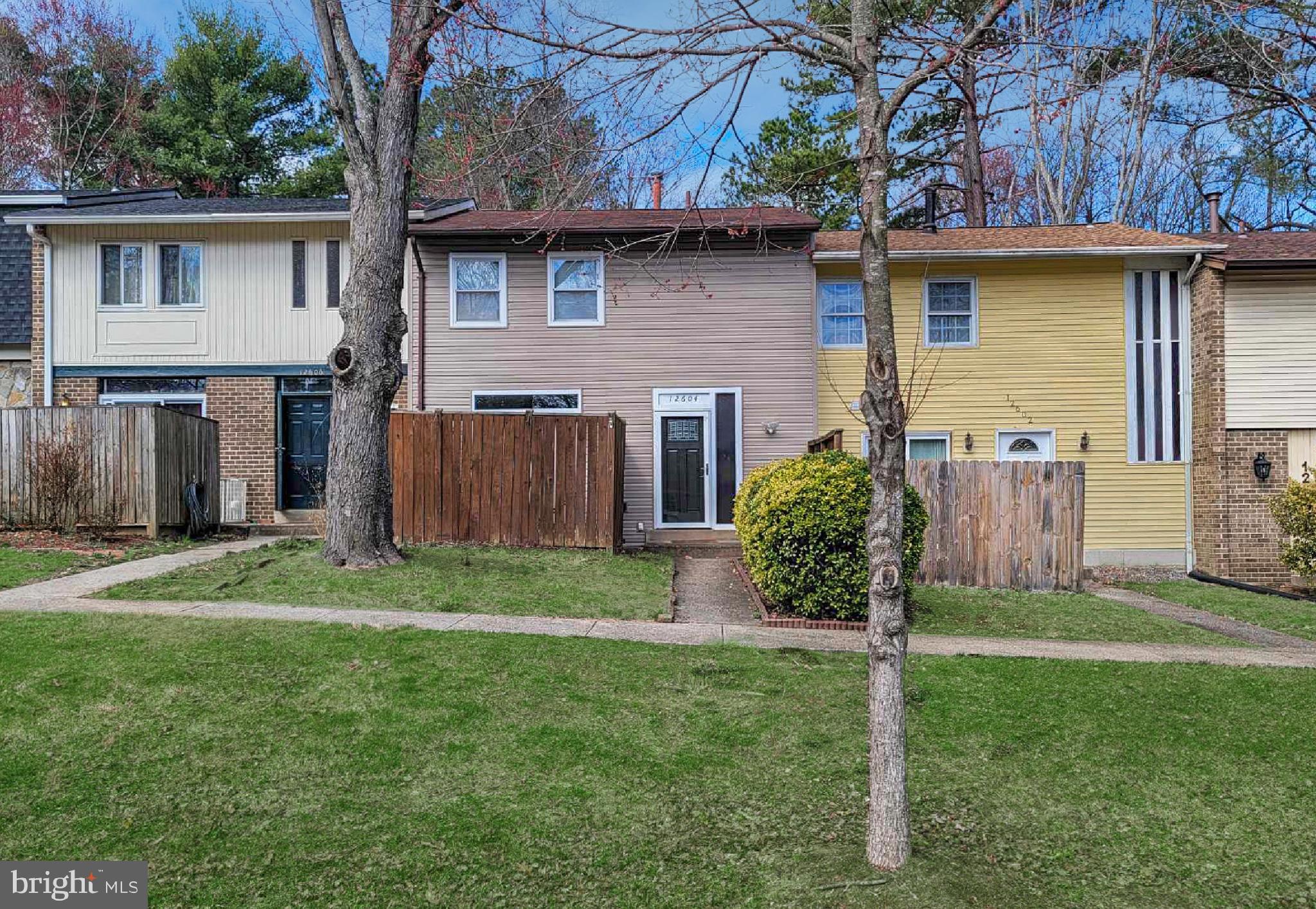 12604 Dulcinea Place Woodbridge, VA 22192 - Photo 53 of 63 a view of a house with a yard and plants
