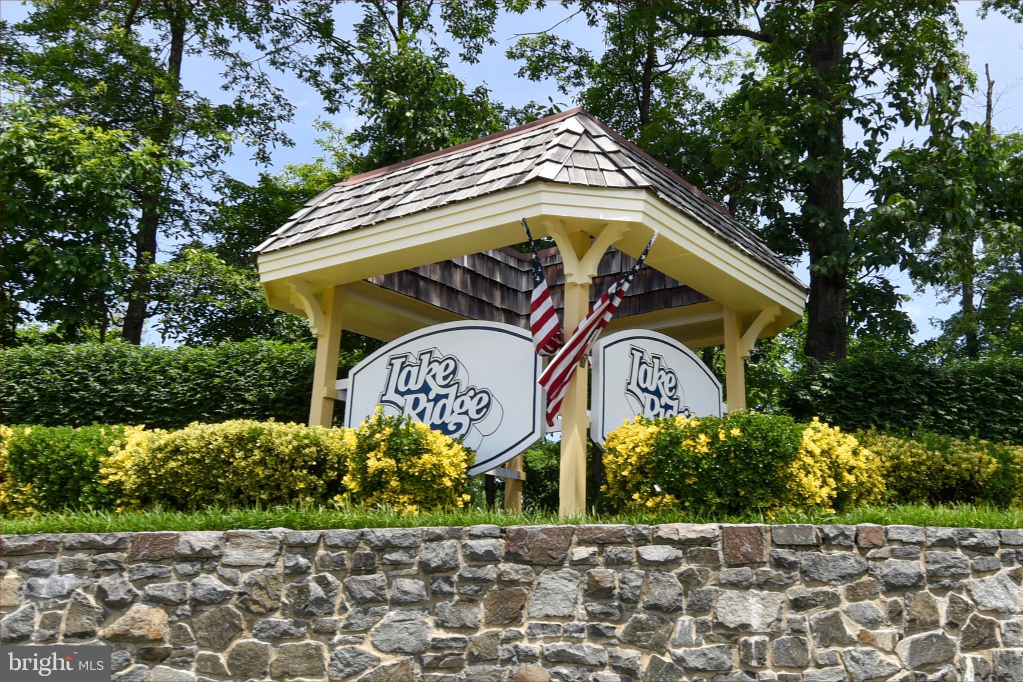 12604 Dulcinea Place Woodbridge, VA 22192 - Photo 55 of 63 a view of sign board with flower around