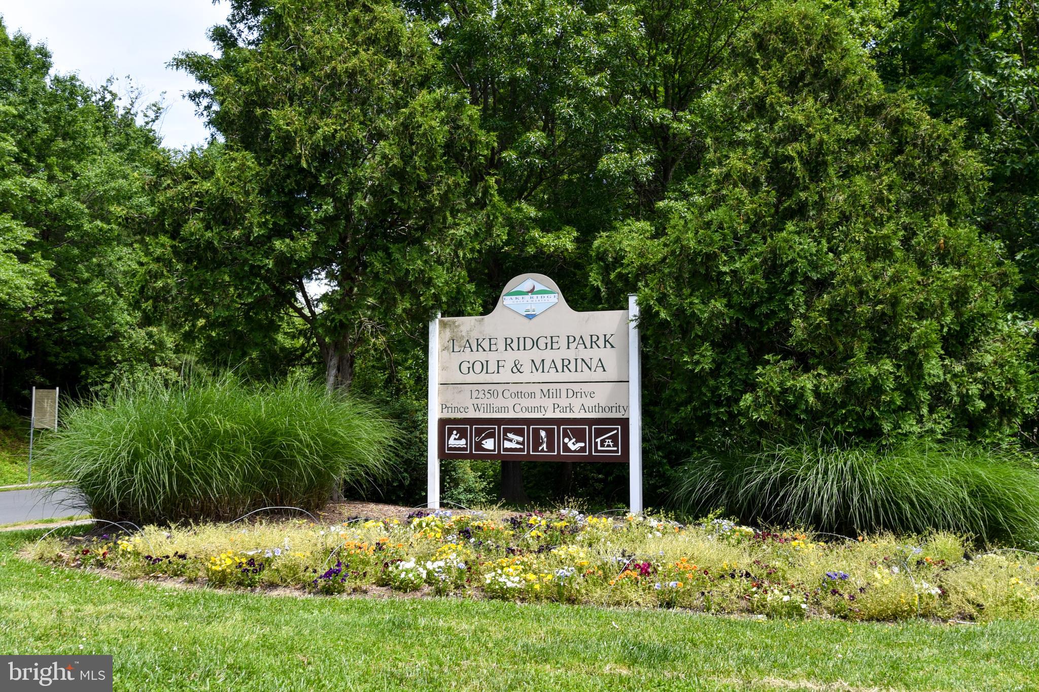 12604 Dulcinea Place Woodbridge, VA 22192 - Photo 59 of 63 a sign on the side of the green field