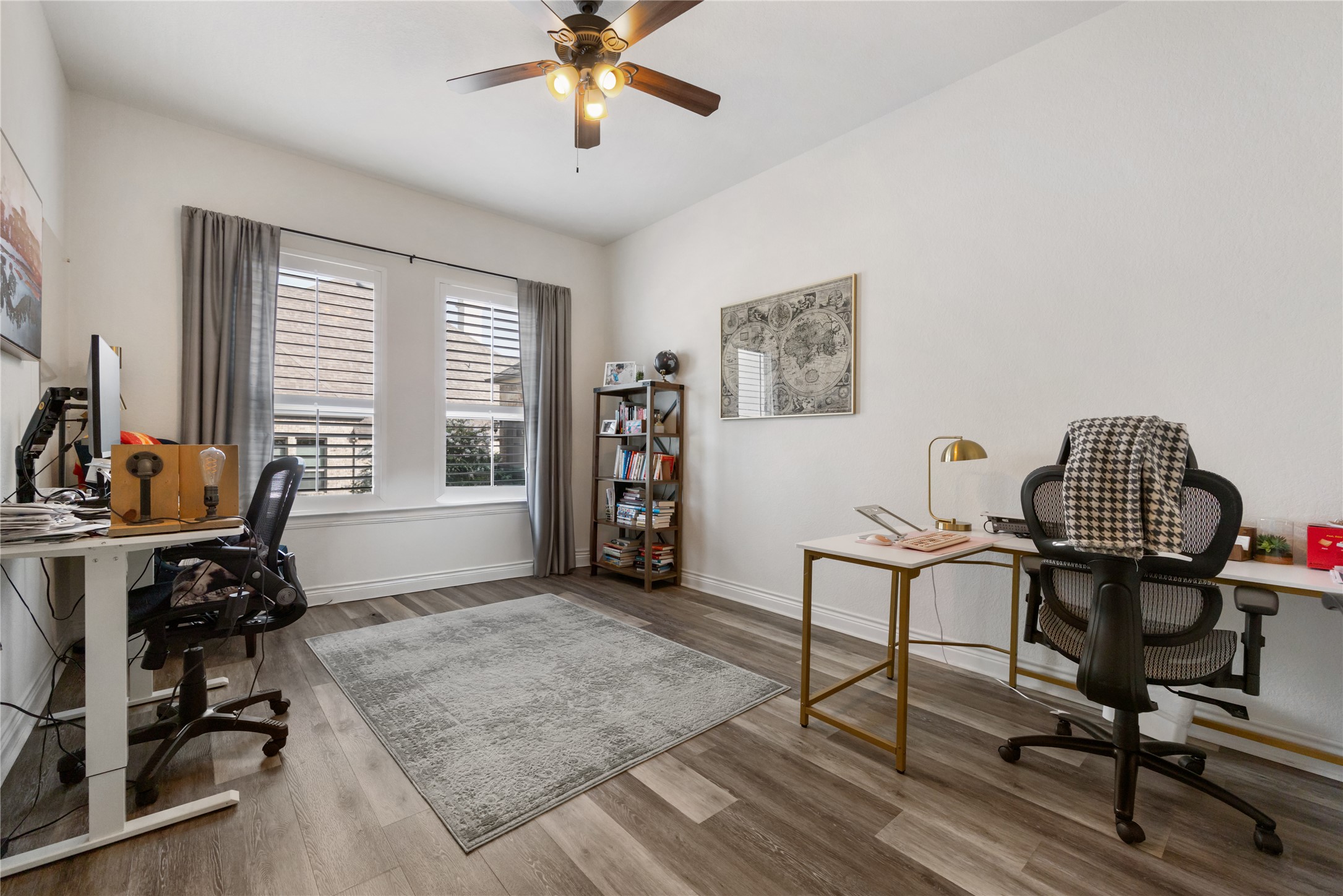 415 Bitterroot Lane Austin, TX 78737 - Photo 15 of 25 A quiet office space offers two large windows for natural light and a rich hardwood floor.