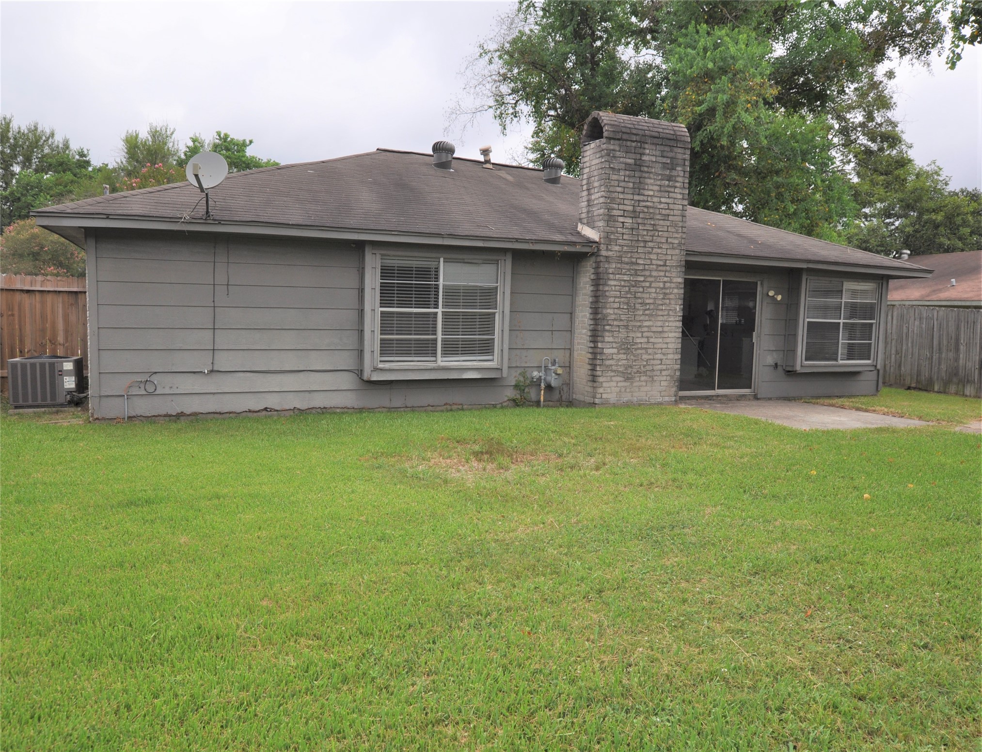 5446 Quail Tree Lane Humble, TX 77346 - Photo 11 of 12 a view of a house with a yard and garage